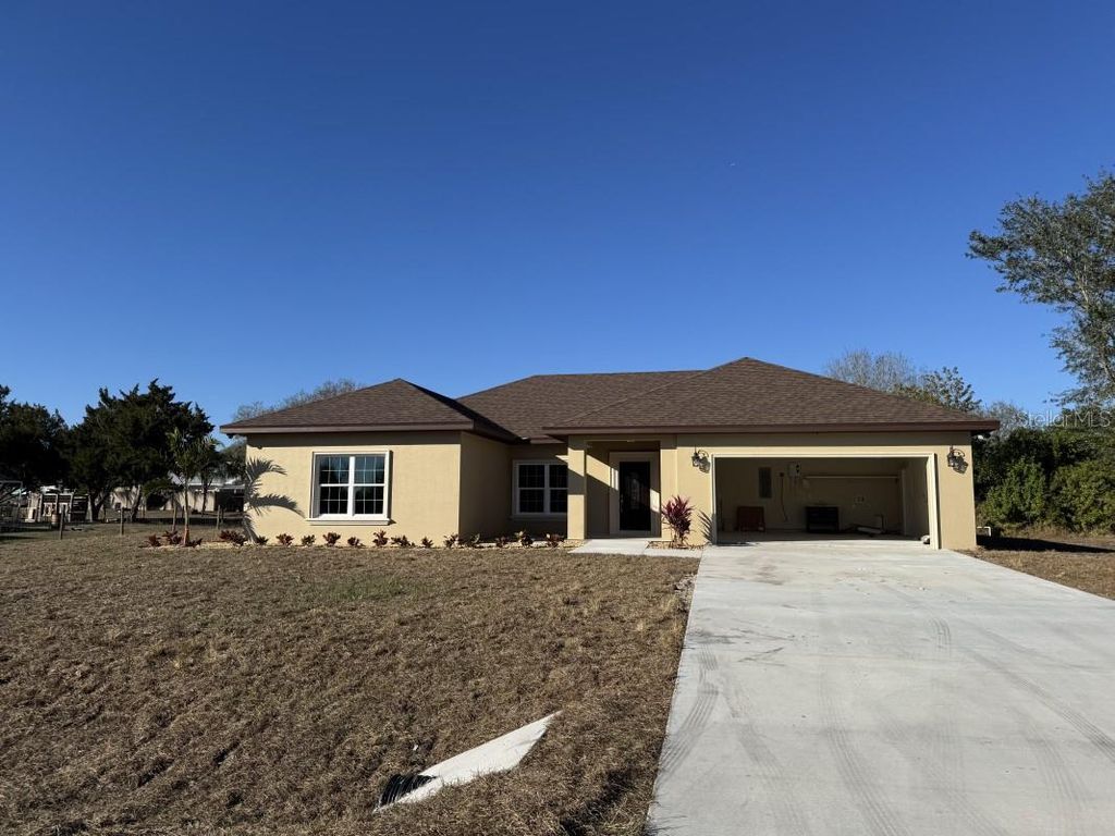 Photo of 8351 SW 14th Lane, Okeechobee, FL 34974 (MLS # A4680207)