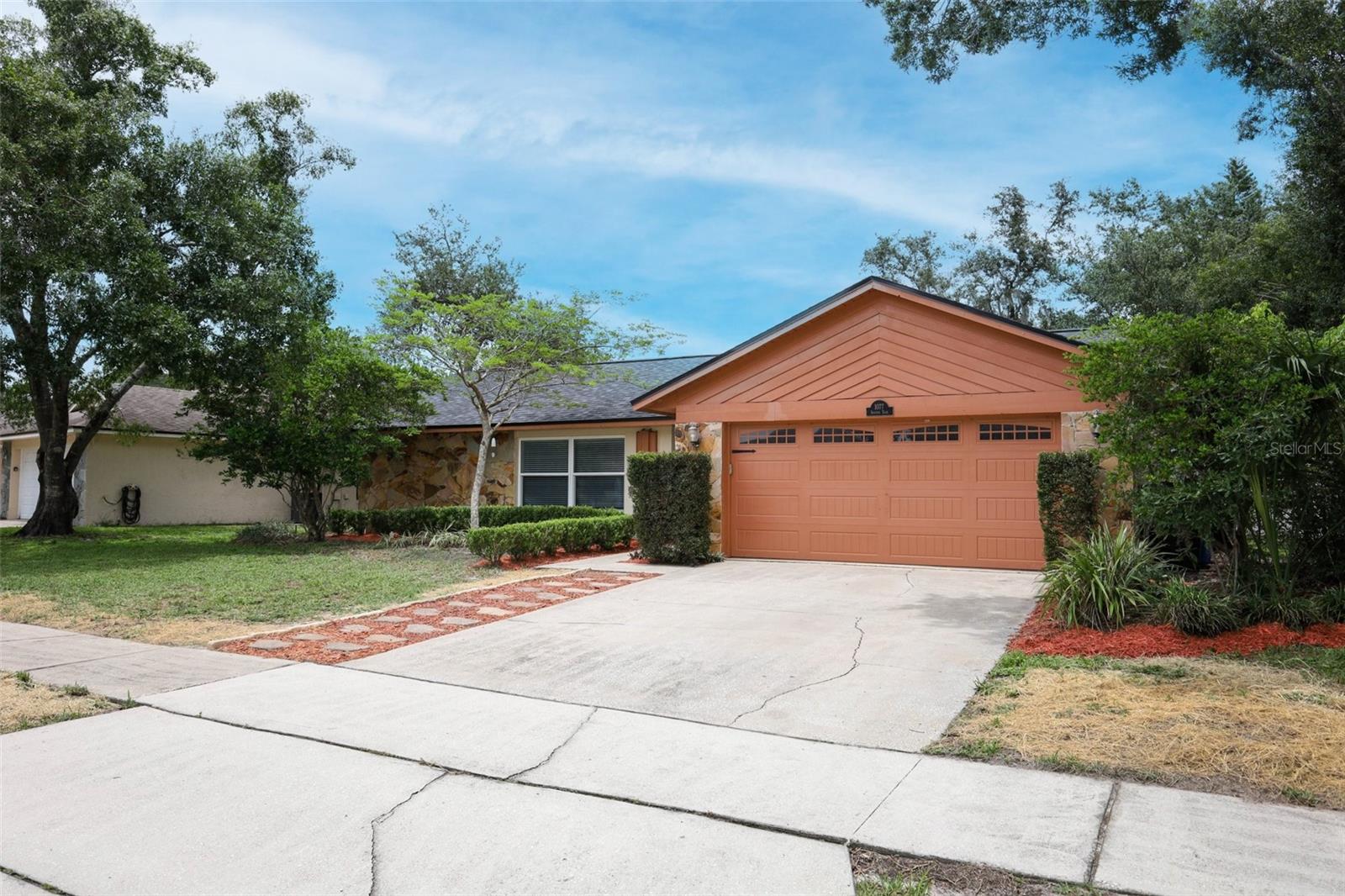 Welcome to this super cute and beautifully updated home nestled in the highly sought-after community of Alafaya Woods. This 3-bedroom, 2-bathroom gem offers a warm and inviting atmosphere from the moment you step inside. You'll love the rich HARDWOOD FLOORS that flow throughout the main living areas, complemented by elegant crown molding and updated baseboards. The remodeled kitchen boasts stunning wood cabinetry, GRANITE countertops, and a layout perfect for everyday living or entertaining. Both bathrooms have been fully renovated with modern vanities, upgraded lighting, and stylish porcelain tile. Additional features include DOUBLE-PANED windows and sliding glass doors, ROOF 2023, a cozy wood-burning fireplace, custom closet built-ins, newer ceiling fans, and a fully fenced backyard—ideal for outdoor fun or relaxing evenings. Don’t miss the opportunity to be conveniently located to top rated schools, shopping, travel, UCF, and the downtown Oviedo amphitheater and park.