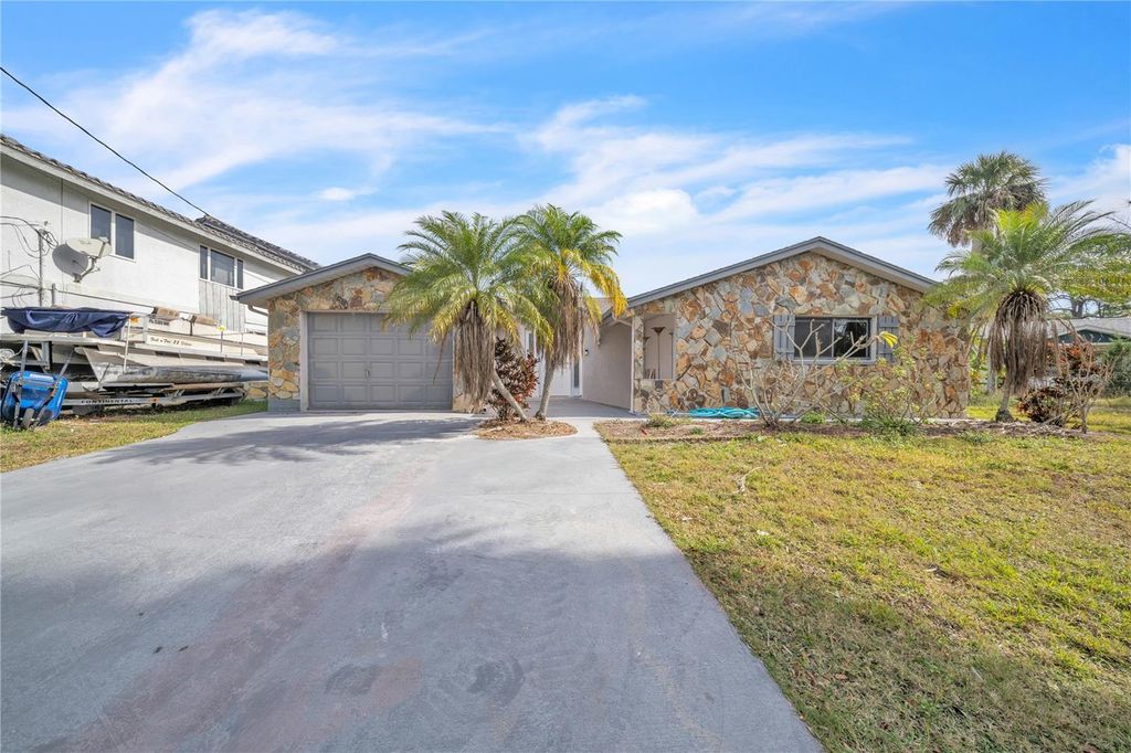 Photo of 5254 Miller Bayou Drive, Port Richey, FL 34668 (MLS # W7883518)