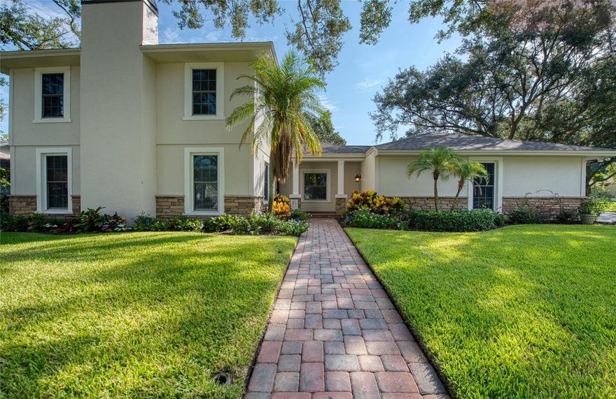 Welcome to your dream Countryside family retreat! This spectacular home is ready to nurture its next family. With 3,520 square feet of heated and cooled living space, it offers 5 spacious bedrooms, 3.5 bathrooms, and a 3-car garage. Step outside and unwind among lush native Florida foliage, serenaded by the soothing sounds of a waterfall and koi pond. A private well sustains the vibrant yard and poolside landscaping, while the pool deck—crafted from exposed shell concrete with elegant travertine edging—adds a touch of coastal charm.
The expansive kitchen and its storage are a chef’s paradise, featuring 30 feet of granite countertops, custom cherry cabinetry, a warming drawer, built-in wine cooler, and a dual-power gas/electric stove with five burners, one and a half ovens, and a convenient pot filler. Under-cabinet lighting sets a warm ambiance, and stainless-steel appliances beautifully complement the oak and ash wood flooring. Entertain effortlessly in the immense great room, complete with a custom-built entertainment center and a 73-inch Mitsubishi TV enhanced by a surround sound system. The master bathroom offers spa-like luxury with a whirlpool tub, walk-in shower, and double-sink vanity.
Practical upgrades include:  Roof replaced in 2016 with Owens-Corning dimensional shingles with a transferable lifetime warranty. Downstairs AC replaced in 2024; upstairs in 2016. Rinnai tankless gas water heater replaced in 2022. Hurricane-rated Anderson sliding doors and insulated impact resistant windows provide energy efficiency and a very quiet environment, while ensuring lasting protection in this high-and-dry, no-flood-zone location. Possible owner financing.