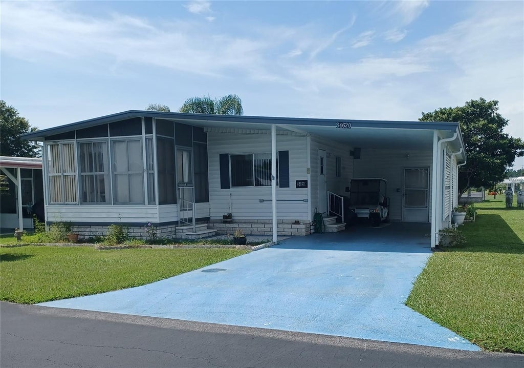 Photo of 34620 Sweetpea Lane, Zephyrhills, FL 33541 (MLS # TB8544617)