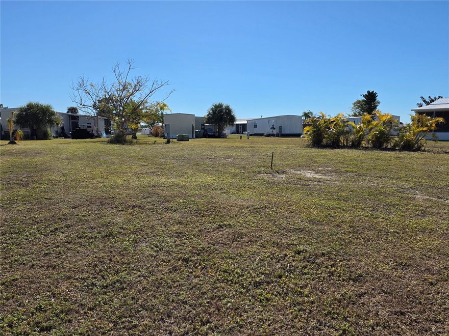Here’s your opportunity for a fresh start in this beautiful GULF ACCESS community! This extremely affordable lot is large enough for a double-wide home with carport, offering the perfect place to bring in your new home. The property features public water and sewer, and the main breaker meter has already been replaced, saving you thousands in upfront costs.

Village of Holiday Lake is a waterfront, Gulf-access community with outstanding amenities, including two large swimming pools, a community boat ramp, fishing pier, and boat slips. Residents enjoy an active social calendar with block parties, horseshoe tournaments, bingo, crafting, woodworking, billiards, and more. Golf carts are welcome, and grounds maintenance is included in the low monthly association fee of $150.

This all-ages, pet-friendly community welcomes pets of any size. Come experience everything Village of Holiday Lake has to offer—you’ll be glad you did!
