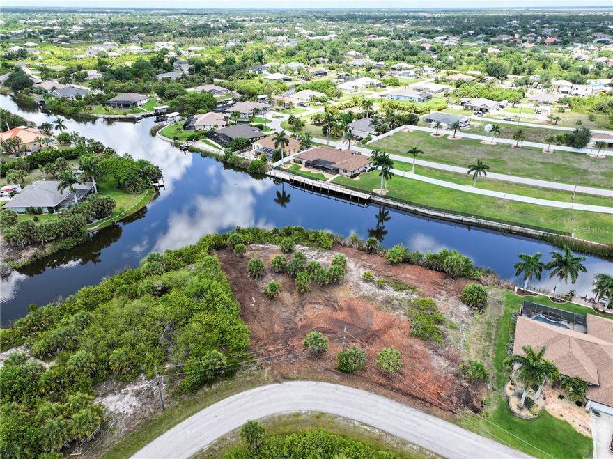 Build your dream home on this exceptional oversized waterfront homesite in the highly sought-after South Gulf Cove community of Port Charlotte, FL. This unique property consists of two combined lots — including an oversized tip lot — creating one expansive parcel with over 250 feet of waterfront and stunning intersecting canal views. Recently mulched and cleared, the property offers a beautiful setting with endless possibilities for a custom home, outdoor living space, and more.
South Gulf Cove is a growing, family-friendly waterfront community where golf carts are welcome and residents enjoy access to parks, walking paths, public boat ramps, and a relaxed coastal lifestyle. Conveniently located near the world-famous beaches of Boca Grande, renowned tarpon fishing, local restaurants, shopping, and entertainment. Just approximately 40 minutes to Punta Gorda Airport and about 1 hour to Fort Myers Airport, making travel easy for both full-time residents and seasonal visitors.
Rare opportunity to own a large waterfront parcel with incredible views and flexibility in one of Southwest Florida’s most desirable boating communities.