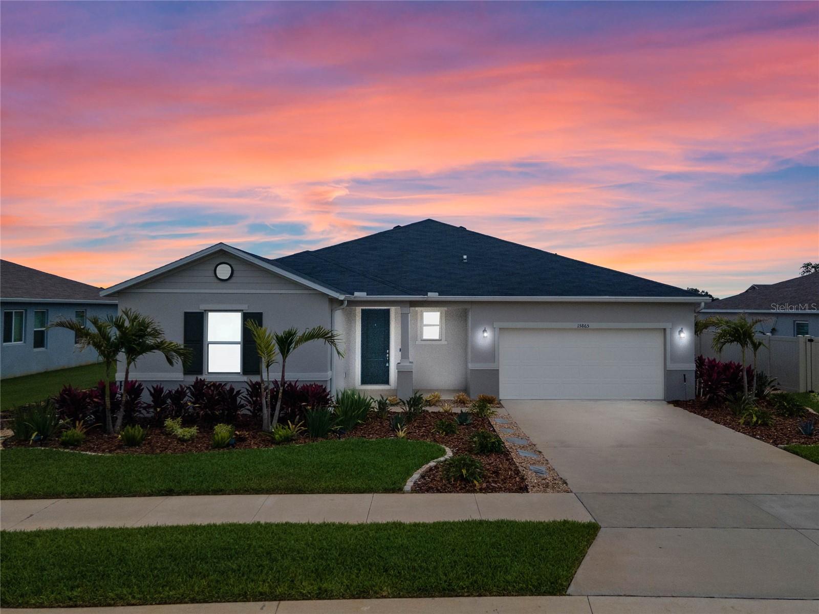 Price improvement!!! Seller is motivated and willing to entertain your offer! You found your perfect new home!!! You will be nothing less than impressed by this four year old home that still has that "new home" smell and feel! As you walk in the front door, you will find two bedrooms to the left and a rarely used guest bathroom! Next you will find the absolutely GORGEOUS dining room followed by an open concept kitchen and great room. There is a beautiful built in electric fire place and wooden shelving that gives the great room a very homey vibe! The kitchen has granite countertops with a HUGE island, neorock kitchen sink, tall kitchen cabinets with crown molding and stainless steel appliances. The floors are ceramic tile, with carpet in the bedrooms. The master bedroom leads to an impressive LARGE walk in closet that you won't want to miss!
The master bath has been FULLY RENOVATED with a river pebble shower floor, custom cabinetry and the extra storage cabinets
stay too! The garage fits two cars with lots of room for storage too! The backyard boasts a patio and recently updated mature,
immaculately kept landscaping. There is also an indoor laundry room and the washer and dryer are included in the sale. Bring your kayaks! Don't miss your chance to own this one of a kind gem in the heart of Clermont, which also backs up to the West Orange Trail.