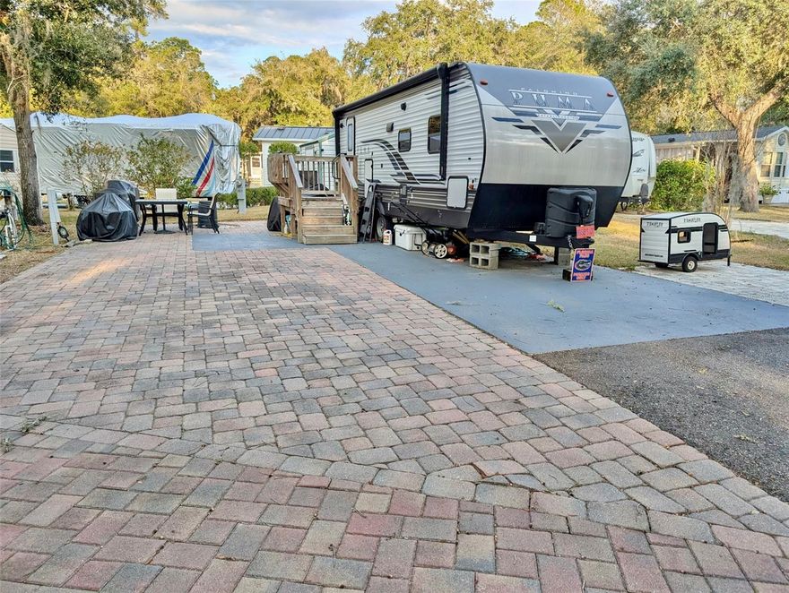 Nice 3,485sqft lot with pavered lot & parking area. Selling lot only; the unit does not convey. The Salt Springs Resort offers club house, 2 pools, tennis courts, dog park, dock & boat ramp to Little Lake Kerr. Walking distance to restaurants, laundromat, post office, shopping, and the springs. Perfect for weekends or full-time residence. HOA fee is $706/quarter. Salt Springs is a nice, quaint area located in the Ocala National Forest.