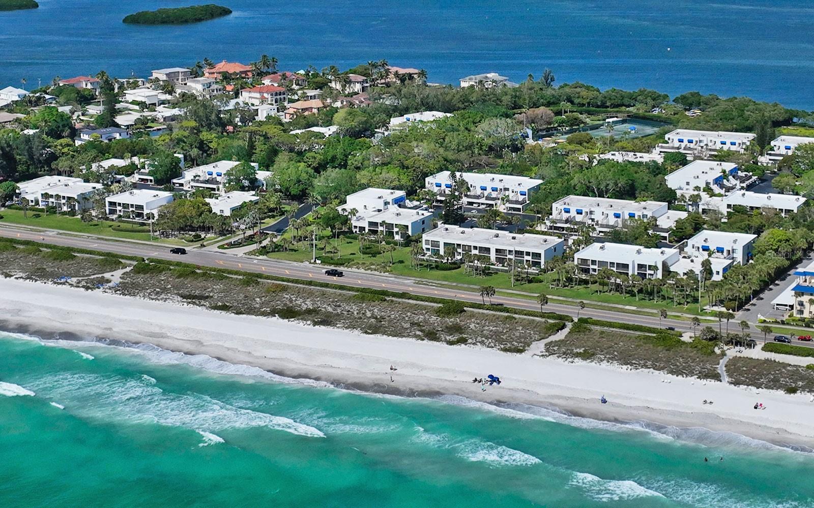 Seasonal Turnkey Furnished Rental at Bayport Beach and Tennis Club. You will fall in love with this wonderful Longboat Key Community, featuring one of the most beautiful beach fronts, and Bay front locations on Longboat Key. This well-appointed and tastefully furnished, updated home welcomes you with its understated elegance. Everything inside is new, from the flooring to the kitchen and baths, the decor is neutral with pops of color, giving the home a coastal urban vibe. The primary bedroom offers a king bed, walk-in closet with built-ins, and a desk. The primary bath has dual sinks and shower. The guest bedroom boasts queen sleeping accommodations and a TV. new luxury vinyl flooring throughout and gorgeous kitchen with stainless appliances, stone counters and lovely wood cabinetry. Outside your door you will find a bonus deck with chaises for sunbathing. This popular, Tim Siebert designed Gulf-to Bay community features 27 lushly landscaped acres, 4 Har-Tru Tennis Courts, a Jr. Olympic pool, kayak launch, bocce ball and fitness room in the clubhouse, and a gorgeous beach, located just across Gulf of Mexico Drive. St. Armands Circle is a short drive away, just over the Ringling Causeway you will find the vibrant downtown Sarasota arts and culture, as well as the many unique shopping and dining venues. Leases less than 7 months subject to additional taxes and fees. Open for 30 day stays June through December and 90 day stays January through April 2026.
