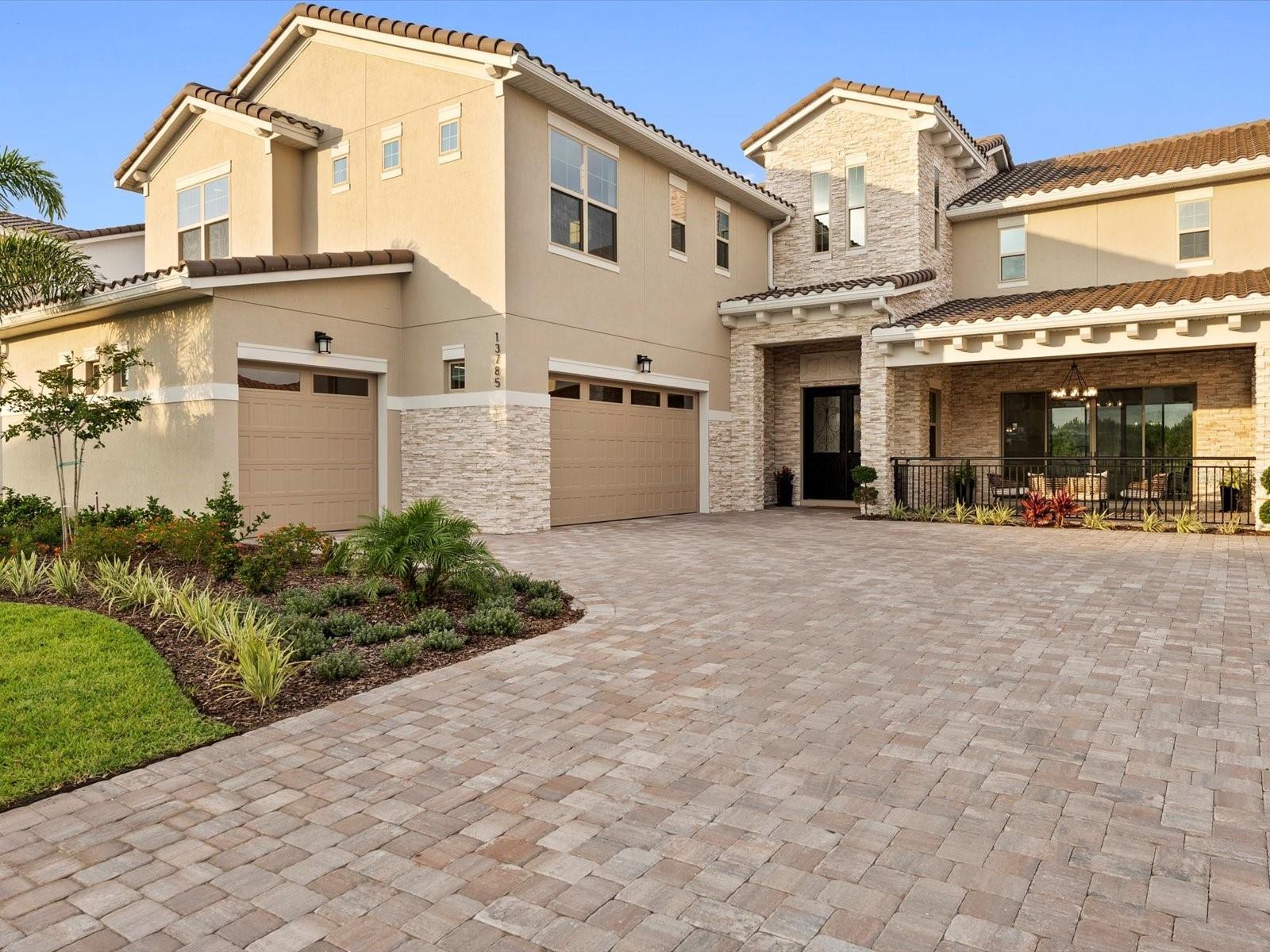 RARE Opportunity to own a Brand-NEW Luxury transitional Pool home on an oversized Conservation and Water-view pie-shaped homesite on the "Street of Dreams" in Guard-Gated Eagle Creek, Lake Nona area! This Southern Dunes model has been designed with the utmost elegance and custom detail to the tune of $430,000 of upgrades including a DACOR high-end appliance package with a $14,000 duel-fuel Steam Oven and 48" Gas range! For those looking for high-end quality newly built homes on oversized private lots, this is a unique chance to walk right in to a custom build without the wait, and with the best location in the neighborhood. As you drive past miles of Audubon Society protected nature on the way to your nearly 7,000 square foot total luxury mediterranean home, you'll feel special driving up the massive paver driveway with oversized 3-car garage and stone facade, plus feel that "Breathing room" with the pie shaped lot affording extra space between the homes, with nothing but nature behind you. Stepping up to the wrought-iron glass inserted front door you'll notice tongue-in-groove wood stained wood ceilings in the front lanai, once inside you're greeted by 2-story ceilings and more wrought-iron railings with a modern look, and views that take you straight back to the crystal blue salt-water swimming pool and spa with marble pool decking, LED lighting, and multiple waterfalls, all surrounded by a huge lot and greenery from the serene conservation behind, not to mention more TnG wood ceilings in the huge covered lanai which is pre-plumbed for a summer kitchen. Speaking of the kitchen, the chef in the family will go Ga-Ga over the 6-burner range with double ovens, all WiFi enabled for cooking those steam cycles to perfection, paired with an oversized LED lit range hood, 42" side by side refrigerator with compressor by DACOR, a drawer microwave, and Gold hardware accents offsetting the full wood dove-tail construction cabinetry all the way to the ceiling of both white and soft grey, underneath a beautiful quartz countertop and Herring-bone pattern subway tile backsplash. The indoor-outdoor living is truly evident with glass and views all around you from the family room, fully smart-home equipped with 7.2 Channel surround sound theatre systems both upstairs and down, 5 Wifi access points, Cat6 ports in every room, 10GB ready (fiber), pre-wires for cameras, holiday lights, backyard audio, all home-runned to a 2nd floor Air-Conditioned smart closet. The Revwood durable and luxurious floors continue into a large double-french door office with amazing views, plus a downstairs en-suite guest bedroom features more bathroom tile upgrades. Upstairs you're welcomed by a wet-bar hangout space with Beverage/wine refrigerator, sink, theater system, and double-sliders out to the expansive balcony with views to Lake Hart. Besides the 3 other guest rooms with 2 more full bathrooms, the Primary suite is enormous and features a drop zone, upgraded carpeting, and more nature views to the east, with Balcony access. Inside the master bathroom you'll find a calming elegant look with white and subtle grey veined marble-look tile all the way to the ceiling in the super shower with rain head, more gold accent hardware and tons of storage space, including a separate makeup vanity. The master closet is huge with built-ins, and the laundry is complete with samsung machines ready to go. See what luxury living in Lake Nona is all about! Schedule your tour today.