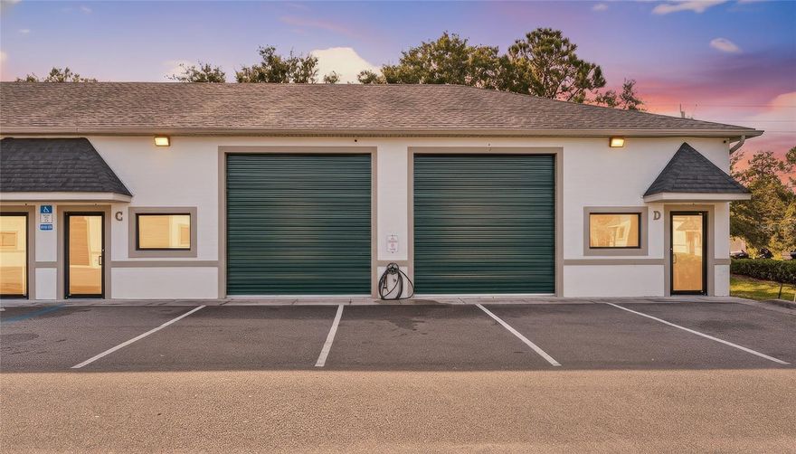 UNITS C & D WILL BE SOLD TOGETHER AND ARE TWO SEPARATE PARCELS - PRIME PORT ORANGE WAREHOUSE OPPORTUNITY! This upgraded double warehouse unit offers exceptional value with 14 ft ceilings, an auto lift, high-grade epoxy flooring, bulletproof impact windows, high-impact doors, and two smart security systems. The interior includes an office, two bathrooms, and open warehouse space ideal for automotive, storage, trade work, or business operations. Two A/C units provide comfort throughout. Located in a sought-after Port Orange area with excellent accessibility. HOA covers roof and building insurance at $500 per quarter per unit. Chandelier in office does not convey.