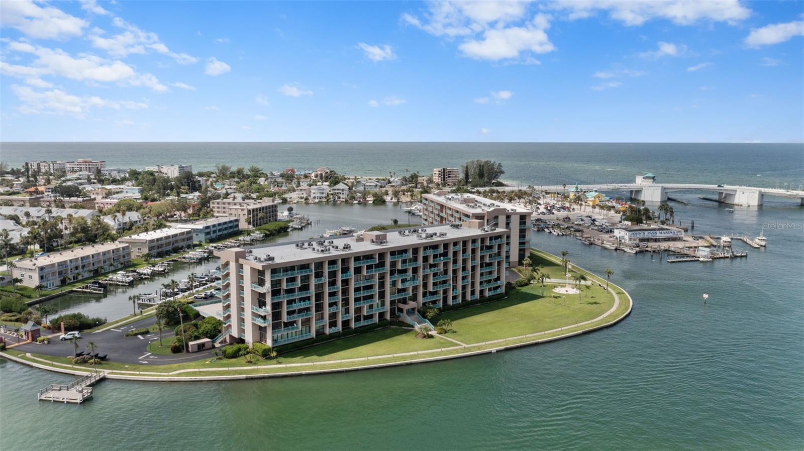 Discover refined waterfront living in this elegantly updated 1-bedroom, 1.5-bathroom condo on the 6th floor of Key Capri, a gated private island retreat in Treasure Island, Florida. Spanning 915 square feet, this airy, bright condo features modern finishes, an open-concept layout, and stunning Boca Ciega Bay views from inside as well as your own private balcony, perfect for morning coffee or sunset evenings. This gorgeous condo features many recent up dates including new luxury-vinyl plank floors throughout, fresh paint, hurricane shutters, bathrooms, modern kitchen with updated stainless steel appliances, in-unit washer & dryer and more. Enjoy resort-style amenities year round, including a geothermal-heated pool, men’s and women’s saunas, tennis, pickleball courts, chip and putt and more. Stay active with the fitness center, fish from the private pier, or explore the 36-slip marina with kayak launch. Relax on the 1/4-mile walking path, socialize in the party room, or unwind in the library or craft room. With 24/7 security, elevators, covered parking, and storage, convenience is assured. Just teps from John’s Pass Boardwalk, you’re close to pristine beaches, boutique shops, and fine dining, blending tranquility with vibrant coastal charm. This is waterfront living at its finest.
