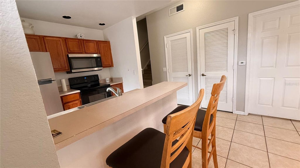 Photo of 2205 San Vittorino Circle #102, Kissimmee, FL 34741 (MLS # S5158518)