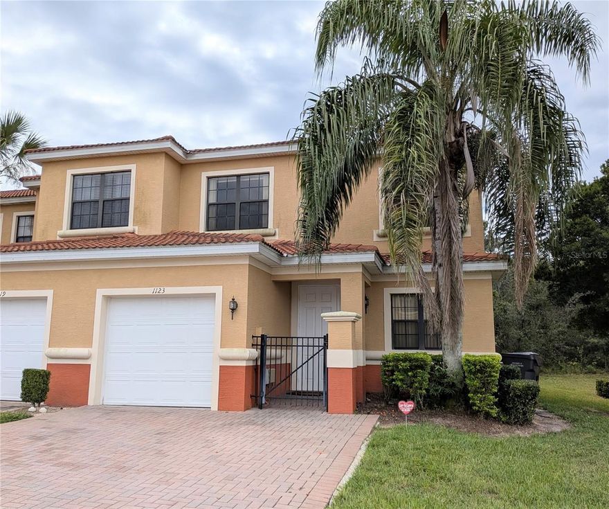 Welcome home to Tuscany Preserve ! This 2 story 3 bedroom townhome has it all, resort living, and a beautiful clean interior ready to move into. Enter the community through the front gate. Enter this townhome into a large living room / Half bath/ laundry room with a lot of storage space, and a one car garage. Through the living room enter the huge kitchen and dining area - The kitchen is a chef's dream with all that granite counter space, and beautiful wood cabinets, and a large closet pantry.  The dining area has sliding glass doors to head in the back screened, covered porch that is your own tranquility overlooking the large wooded lot out back.   Up the stairs to the second floor find the primary suite with full bathroom/ stand up shower, tub, and walk in closet.  The second and third bedrooms share a full bathroom.  This is truly resort living at it's finest. The community has a beautiful swimming pool, tennis courts, fitness center, basketball courts, childrens playground/play pad area. Tuscany Preserve is just 30 miles from the theme parts, and close to shopping, restaurants, and close to the amenities of Poinciana Village and Lake Marion Wildlife Preserve.  So close to what makes Florida the perfect playground both on land and water sports.  Make your appointment today to view this property.  This is the perfect primary residence, vacation home or investment property.