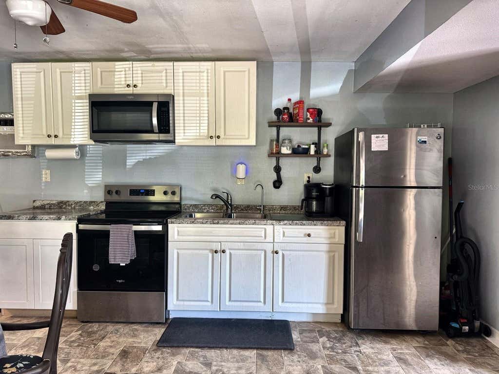 Photo of 6838 N Carl G Rose Highway, Hernando, FL 34442 (MLS # OM730917)