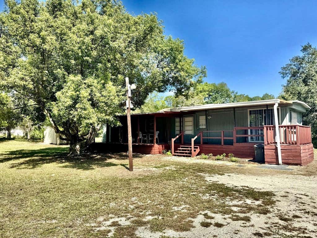 Photo of 6838 N Carl G Rose Highway, Hernando, FL 34442 (MLS # OM730917)