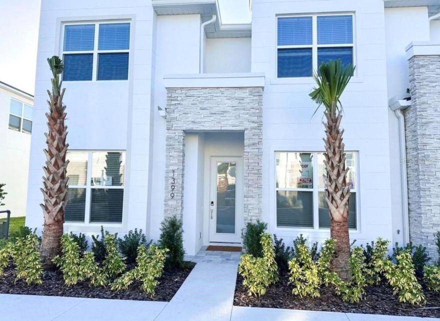Welcome Home to this stunning 4 Bedroom 3 Bath townhome with pool in the desirable subdivision of Tranquility. This community is located in the Rolling Hills of Clermont, just 15 minutes from Disney and all the attractions. A few minutes to many shops, restaurants and Margaritaville. This townhome offers a open plan feel with a sleek European flair. The kitchen offers seamless cabinetry with Quartz countertops, state of the art appliances and an amazing view of the living space and pool beyond. The sliding doors lead out to your enclosed pool, offering plenty of privacy for your own retreat. There is a full size bedroom with ensuite downstairs and the Primary suite and 2 additional bedrooms and a third bathroom are upstairs. Offering plenty of privacy for the family or professionals alike. The community also offers a clubhouse, Gym, heated pool, spa and playground. Call today for your own private tour of this modern townhome, furniture is optional and can be included with purchase. Property currently renting on Airbnb and other rental applications with NO restrictions.