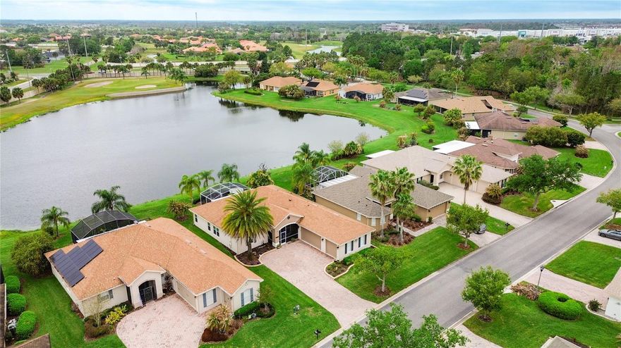 Under contract-accepting backup offers. STUNNING SAVOY Model w/ a 3 CAR GARAGE with WIDE WATER & GOLF COURSE (across the pond) VIEWS in the Bella Viana subdivision of Solivita! **See the FULL LENGTH VIDEO Tour Link 1.** The EXPANSIVE LANAI is PARTIALLY COVERED w/ metal roof, SCREENED & EXTENDED w/  2 Ceiling Fans, 2 exit screen doors. It offers unbelievable WATER & GOLF COURSE VIEWS!  Facts about the home: 18 WINDOWS new in 2022. ROOF new in 2016. HVAC new in 2013. UPGRADES INCLUDE: 8' Doors, PLANTATION SHUTTERS, extensive CROWN MOLDING, ROUNDED CORNERS, 5 1/4" BASEBOARDS & BAMBOO & TILE floors throughout (w. exception of Primary Bath). CEILING FANS in most rooms. The KITCHEN boasts QUARTZ counters, 42" upper cabinets, SLIDE IN RANGE, lower cabinets w/ PULL OUT drawers, RECESSED & PENDANT lights, SUBWAY TILE BACKSPLASH, Pantry Closet & STAINLESS STEEL appliances. The PRIMARY SUITE has a FRENCH DOOR entry, TRAY CEILING, Linen Closet & a Nice sitting area/workspace plus 2 WALK IN CLOSETS. PRIMARY BATHROOM has been upgraded with QUARTZ COUNTERS w/ DUAL SINKS, Raised Vanity & Makeup Area. The SHOWER was redesigned with SUBWAY TILE & SEAMLESS GLASS Enclosure. Bench Seat outside of shower. VINYL TILE style Flooring. The 2nd & 3rd Bedrooms are connected by a JACK & JILL Bathroom w/ QUARTZ Counters & Raised Vanity. Shower boasts thicker glass doors. Laundry Rm has Custom Cabinetry & Closet. GARAGE has EPOXY Floor, Storage Closet. MyQ Garage Door System (1 Unit) ***Solivita is an active adult 55+ community located in Kissimmee, Florida. It is approximately 50 minutes from Disney World & the Orlando International Airport. Solivita has a total of 5,470 homes. Approximately 10,000 - 11,000 people live in Solivita during the winter while approximately 7,500 live in Solivita during the summer. Enjoy your active years in this piece of paradise. Solivita's amenities include: - a manicured SOFTBALL diamond & field - 36 holes of CHAMPIONSHIP GOLF that can be played by joining the Stonegate Golf Club or paying as you go - 2 STATE of the Art AMENITY centers with updated exercise equipment, yoga studio & meeting rooms - 3 restaurants - 14 HEATED POOLS - 17 PICKLEBALL courts - 9 TENNIS courts - 4 BOCCE BALL courts - 4 SHUFFLEBOARD courts - 3 HORSESHOE pits - a BILLIARDS room - miles of bike paths - 2 DOG PARKS (Small & Large Dogs) - Corn Hole - Tot Lot PLAYGROUND - COMMUNITY GARDEN - over 250 resident clubs. The HOA: - maintains the LANDSCAPING & IRRIGATION systems in the common areas as well as at individual homesites - maintains the roads throughout the community - PROVIDES SECURITY with gate guards and mobile patrols including the Polk County Sheriff - allows AUTOMATED GATE ACCESS for residents via license plate readers - provides residents with Fiber Optic Internet & TV service.***Poinciana Lakes Plaza is a MAJOR NEW SHOPPING CENTER that opened directly across from the Solivita Main Gate in Summer of 2024. It features Sprouts Grocery, TJ MAXX, Ross, Burlington, Rack Room Shoes, 5 Below, Ulta, Outback, First Watch, 5 Guys, Urgent Care, Dentist, TD Bank, Petco & Hair Cuttery PLUS MORE TO COME.***