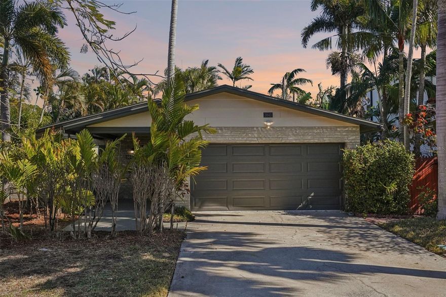 Welcome to Shore Acres Overlook, a completely remodeled and truly move-in-ready home located in one of Northeast St. Petersburg’s most loved neighborhoods. Nestled in Shore Acres, this solid block three-bedroom, two-bath residence offers the perfect blend of modern updates and everyday comfort. Inside, you’ll find brand-new flooring throughout, beautifully renovated bathrooms, and a stunning kitchen featuring white shaker cabinetry, granite countertops, stainless steel appliances, and a charming dining area that feels both bright and inviting. Lush green grass and mature landscaping create welcoming curb appeal, while the two-car garage and oversized double driveway provide plenty of space for family and guests. The thoughtfully designed layout includes a spacious main living area, a versatile first bedroom with French doors, a private second bedroom near the updated guest bath, and a comfortable primary suite with sliding glass doors leading to a private patio and a fully tiled walk-in shower in the en-suite bath. Direct access from the garage into the kitchen makes daily living easy and practical. Step outside to a tranquil backyard retreat framed by mature landscaping and swaying palms—ideal for relaxing evenings or weekend gatherings. Beyond the home itself, Shore Acres is known for its strong sense of community, nearby parks, and convenient access to everything that makes this area so desirable. You’re just minutes from downtown St. Petersburg’s waterfront parks, dining, and vibrant arts scene, close to the Shore Acres Recreation Center, and a short drive to Tampa Bay, Weedon Island Preserve, top-rated schools, shopping, and easy interstate access for commuting. Stylish, updated, and ideally located—this home delivers the Florida lifestyle buyers are looking for at an unbeatable price.