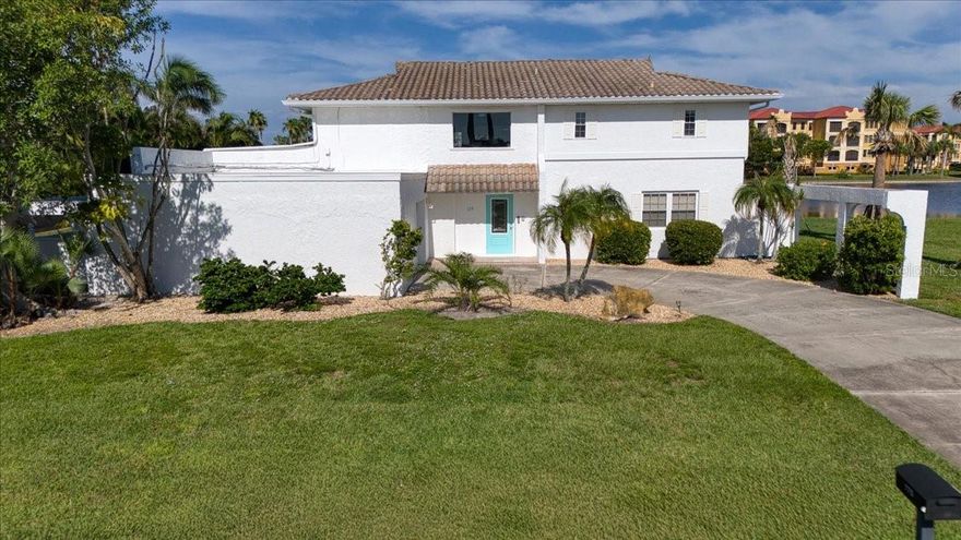 Statuesque & Impressive Two-Story Waterfront Home in Punta Gorda Isles! Experience breathtaking water views from the moment you step inside this expansive 4-bedroom, 5-bathroom residence, offering over 3,000 sq. ft. of living space and an attached 2-car garage. Upon entry, you’re greeted by an elegant staircase and an open-concept design featuring a spacious living room, dining area, and three sets of impact glass sliders that open to the expansive outdoor living area—complete with a 30 x 13 in-ground pool and breathtaking water views. Designed for the Florida lifestyle, the seamless indoor–outdoor flow is perfect for entertaining. The main level features two generously sized bedrooms, each with its own ensuite bathroom. The well-appointed kitchen boasts granite countertops, stainless steel appliances, a breakfast bar, and an adjacent dining space. A first-floor laundry room with washer, dryer, cabinetry, and laundry sink adds convenience, while an abundance of natural light fills the home. Upstairs, the open layout continues with a sunlit living area, built-in bar, and French doors leading to a covered outdoor deck. The enormous primary suite offers spectacular water views, two luxurious ensuite bathrooms, and expansive closet space. A second large upstairs bedroom with a private full bath completes the second floor. Perfect for hosting family, welcoming winter guests, or enjoying peaceful waterfront living, this home offers unmatched comfort and style. Ideally located just one mile from Ponce De Leon Park and minutes to golf, Fishermen’s Village, and historic downtown Punta Gorda’s shopping, dining, and waterfront parks. Close to boat ramps, fishing piers, art galleries, farmers markets, and more!