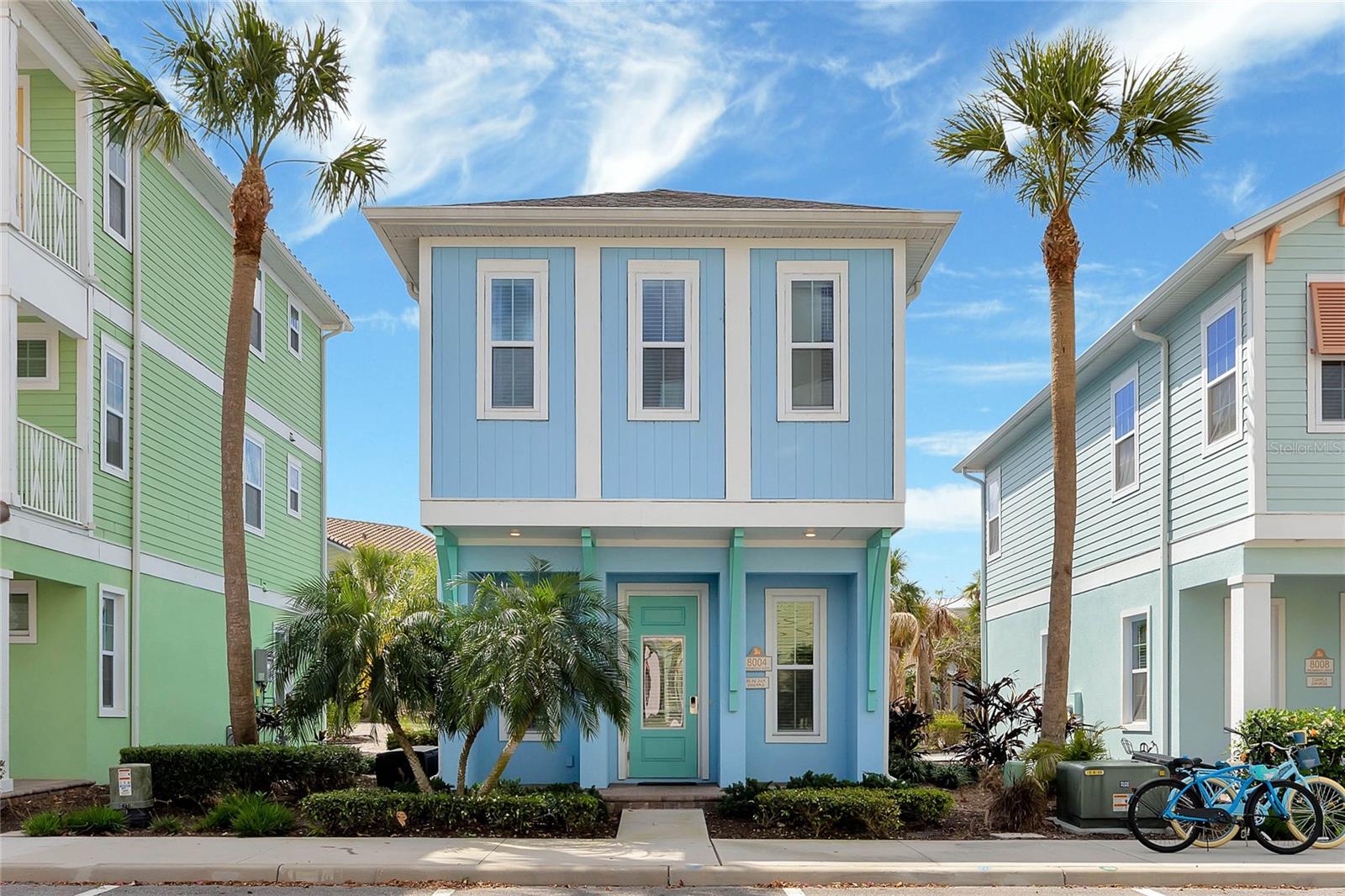 Welcome to Paradise at Margaritaville Resort Orlando! This stunning 2-bedroom, 2.5-bath cottage is nestled in one of the resort’s premium locations, just minutes from Walt Disney World. Built in 2019, the home seamlessly blends island-inspired charm with modern upgrades for a truly turnkey experience. Enjoy a covered front porch and spacious back patio surrounded by lush foliage and shell-lined pathways. Inside, you’ll find wood-look tile flooring, quartz countertops, high-end appliances, and in-ceiling speakers that sync effortlessly with your TV or phone bringing vacation living to life. Internet, cable, landscaping, valet trash, 24 hour security, and more are all included with your rent! Upstairs, the primary suite offers a peaceful escape with dual sinks and a walk-in shower, while the second bedroom features its own full insuite bath with a soaking tub. A convenient half bath on the main level and a full-size washer and dryer make longer stays or back-to-back guest bookings effortless. This home is being RENTED fully furnished with the Margaritaville-approved “SAIL AWAY” Furniture and Housewares Package, a $25,000 value that includes everything from TVs and blinds to linens, dishware, and coastal-inspired artwork. Renting in Margaritaville means access to a world-class lineup of resort amenities, including oasis-style lagoon pools, full-service bars, restaurants, fitness center, relaxing spa, live music venues, dog park, movie theater, on-site water park, retail village, and more. It’s not just a home, it’s a lifestyle filled with sun-soaked days, live music nights, and the carefree feeling of always being on vacation. Ready to live the Margaritaville lifestyle? This fully furnished cottage is move-in—and vibe-out—ready. Call or text me for an easy showing of this one-of-a-kind tropical escape.