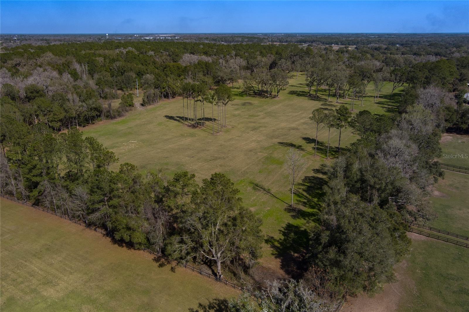 This fantastic 28.84 is perfectly located deep within the NW Marion County horse community. Being only 10 minutes to WEC makes this an even more ideal location. You're minutes away from world class horse events, fine dining and pub fair, refreshing libations, shopping, year-around festivities, and an array of overnight accommodations for your guests at the WEC! This property is cleared and dotted with shade trees. It is perimeter fenced and provides a wonderful space to build your new farm to your exact specifications.
