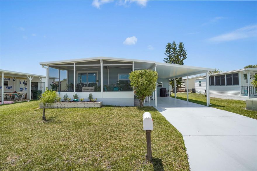 This beautifully updated 2BR/1BA home in the sought-after 55+ waterfront community of Harbor Cove offers comfortable Florida living just steps from the clubhouse and pool. With approx. 720 sq. ft. of interior space plus a 200 sq. ft. screened lanai, this home has had nearly every major component already upgraded, making it easy to simply move in and enjoy. Featuring a relaxed cottage-inspired style with a unique mix of modern and vintage pieces, all décor and furniture are included. Inside, you'll find updated flooring, lighting and fixtures throughout, and a remodeled kitchen featuring butcher block countertops, stainless appliances, and updated cabinetry. The bathroom has also been tastefully renovated with an updated vanity and walk-in shower. The primary bedroom offers a bright and comfortable space, while the second bedroom provides a flexible guest or office area. The screened lanai with ceiling fan adds valuable bonus living space, and the backyard offers plenty of room to add a large patio or deck with partial lake views. Major improvements include a NEW Air Conditioner,  driveway painted, home pressure washed, (2026), water heater, vapor barrier (2025), 40-foot carport, lanai, shed and siding (2023), membrane roof (2022), and windows, updated electrical panel and pedestal, subfloors replaced with additional 2x4 floor bracing, flooring, kitchen and bathroom remodels (2021). A recent passing 4-point inspection is available, and the seller is offering a home warranty for added peace of mind. Great location about 100 steps from the clubhouse and pools. Residents enjoy access to two pools, spa, marina, billiards room, bocce and shuffleboard courts, fitness room and pickleball/tennis courts. The 90-slip marina has boat slips for only $300 annually with direct access to the Myakka River leading to the Gulf. Harbor Cove offers an active social lifestyle with clubs, dances, and community events throughout the year. Located near beaches, shopping, dining, golfing and farmers markets.  Schedule a showing for a closer look!