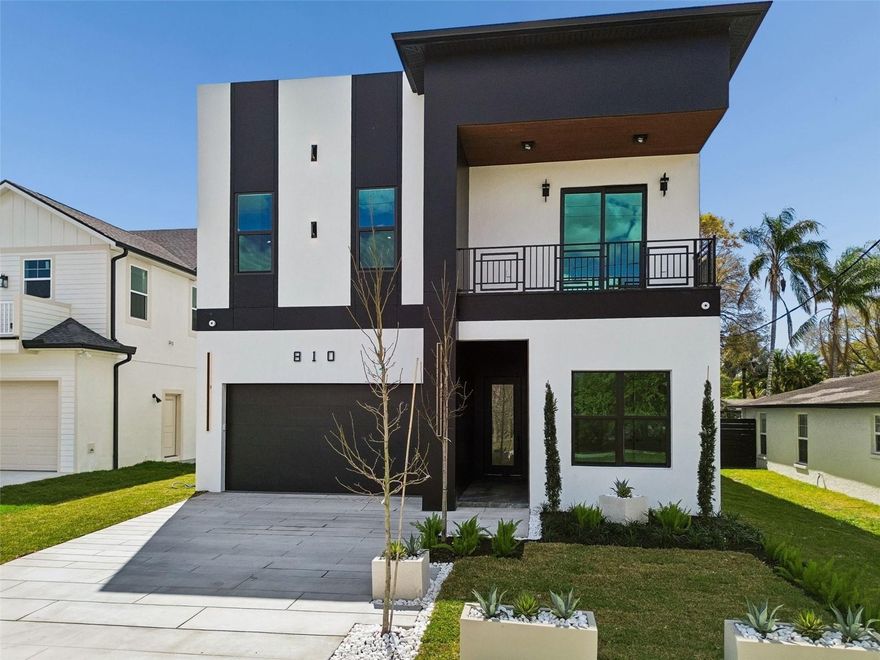 Located on one of the most desirable streets in Riverside Heights, this exceptional 4-bedroom, 4-bathroom new construction home offers 3,513 square feet of thoughtfully curated living in an X flood zone. Engineered hardwood floors, solid-core doors, and designer finishes set the tone throughout. The custom kitchen features Bosch appliances, a dry bar with wine cooler, a spacious walk-in pantry, and a stunning quartz island that anchors the open-concept living space. A first-floor guest suite adds flexibility, while upstairs offers a built-in media room that can be easily converted into a fifth bedroom if desired. The primary suite offers a true retreat with custom closets for both his and her, a spa-inspired bath complete with a cast stone freestanding tub, Kohler and Delta fixtures, and an oversized walk-in shower. Designed for both comfort and efficiency, the home includes aluminum impact windows and sliders, foam attic insulation, two HVAC units, whole-house air purification, reverse osmosis and full water filtration systems, and prewiring for smart home features and cameras. Step outside to over 1,000 square feet of limestone decking, a 12x29 pool, and a 14-foot outdoor kitchen, designed to fully embrace the Florida lifestyle. This Riverside Heights masterpiece offers luxury, location, and lifestyle - all just minutes from Downtown Tampa, Armature Works, and the Riverwalk. *Pool and fence projected to be completed week of March 16th.