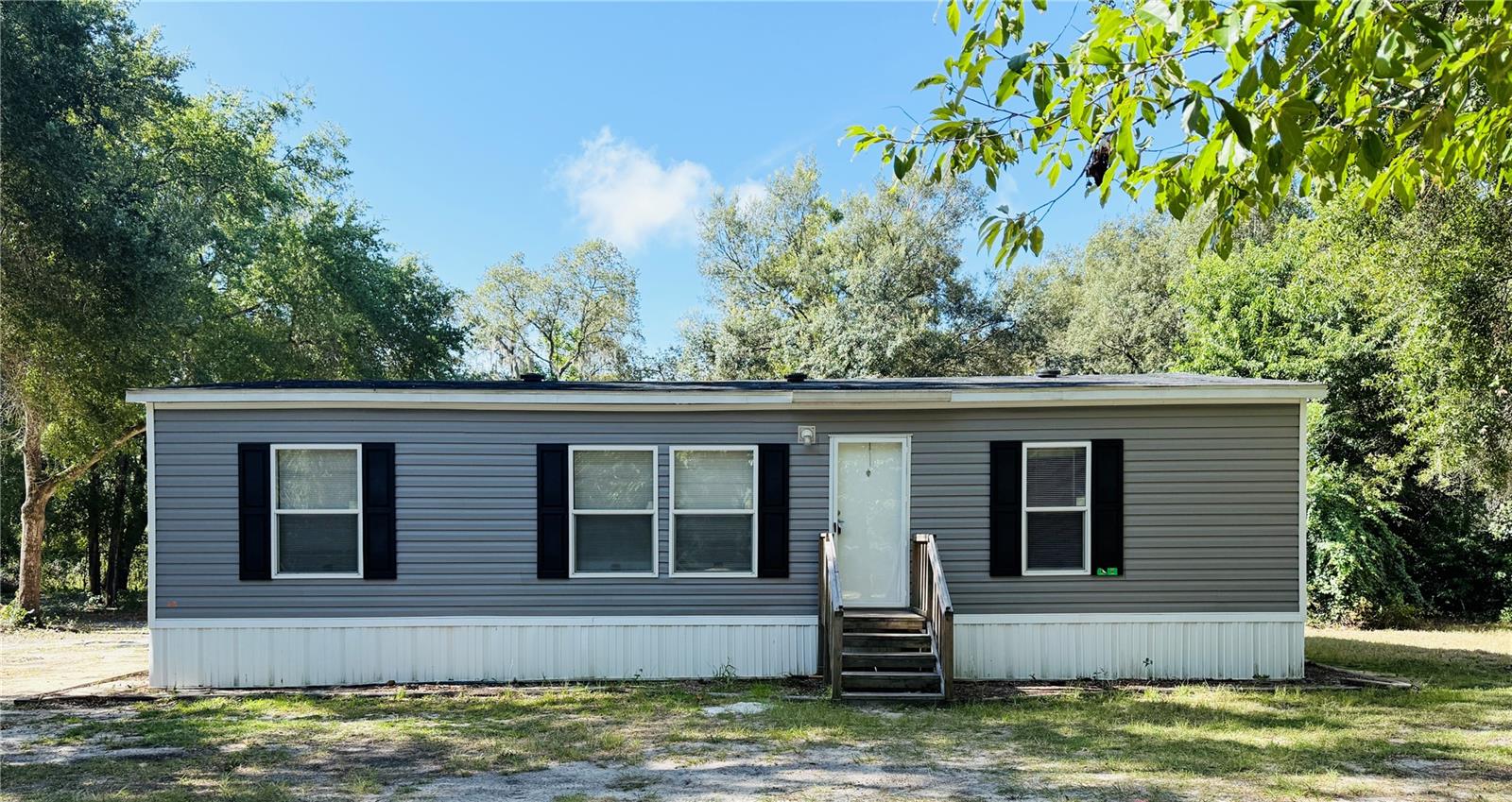 Country living at its finest!
This spacious 3-bedroom 2-bath manufactured home sits on a half an acre lot with beautiful mature trees. Features include high ceilings, central heat, and air with overhead ducks, and plenty of natural light. Located on a quiet street, but still close to downtown Keystone, grocery stores, and shopping.
Available now-come see your new home today!