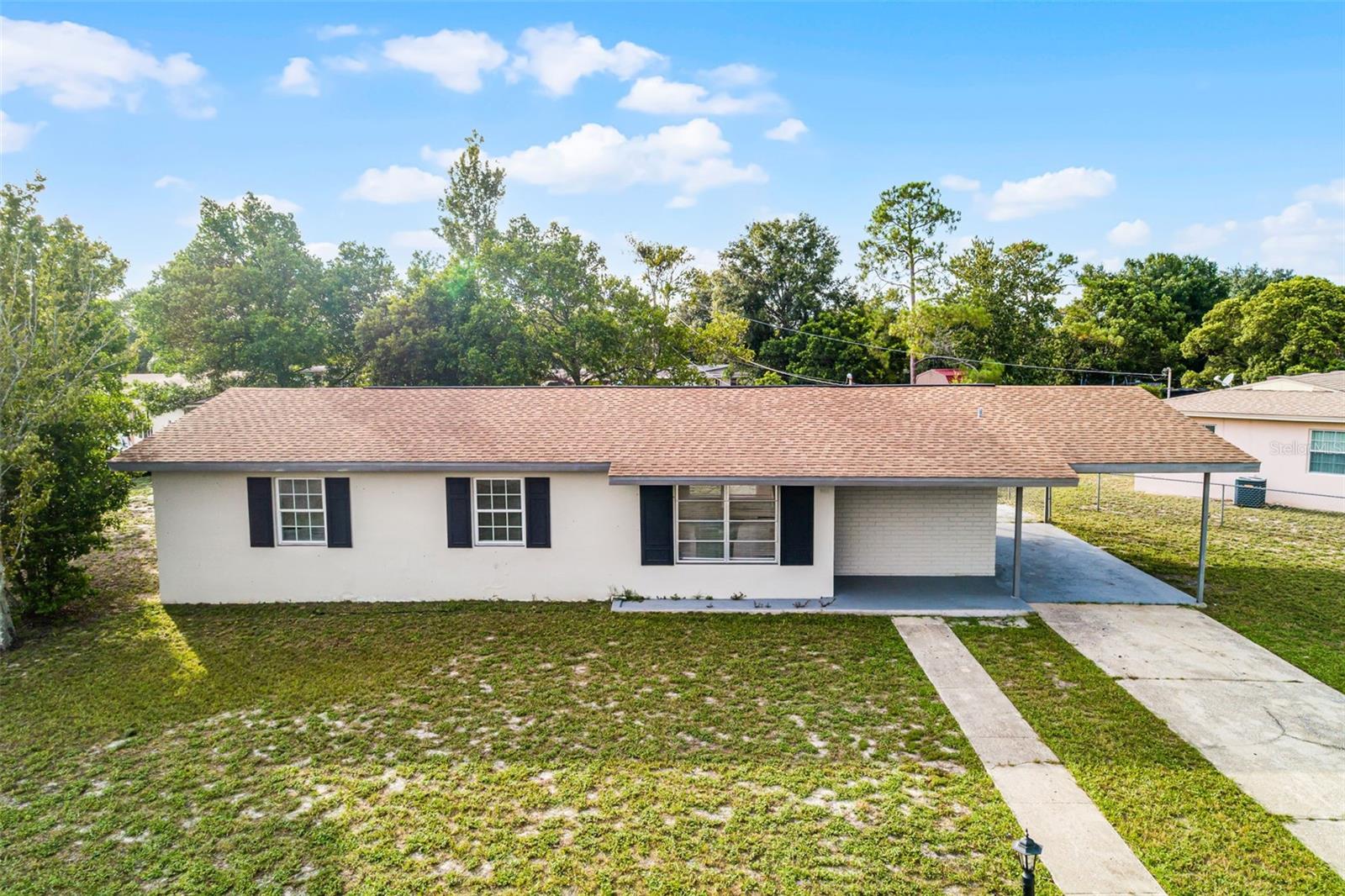 Discover your new home in the desirable Deltona Lakes community. This single-story ranch offers 3 bedrooms, 2 bathrooms, and 1,258 square feet of living space on a spacious corner lot. Inside, newer laminate flooring extends throughout, and the updated kitchen features contemporary cabinets with generous storage.
Recent improvements include a roof replacement in 2019, a water heater in 2021, and an outside AC unit in 2023—providing comfort and efficiency. With no homeowners’ association fees, the property offers flexibility for a variety of lifestyles.
Located in Deltona Lakes, this home is close to four state parks within five miles, Lake Monroe for boating and aquatic recreation, and the Central Florida Zoo & Botanical Gardens. Shopping, dining, and retail destinations such as Altamonte Mall are nearby, along with major employers including AdventHealth and Seminole State College. Orlando’s entertainment, cultural, and theme park attractions are less than 50 miles away.
Blending modern upgrades, convenience, and a prime location, this Deltona home is ready to welcome its next owner.