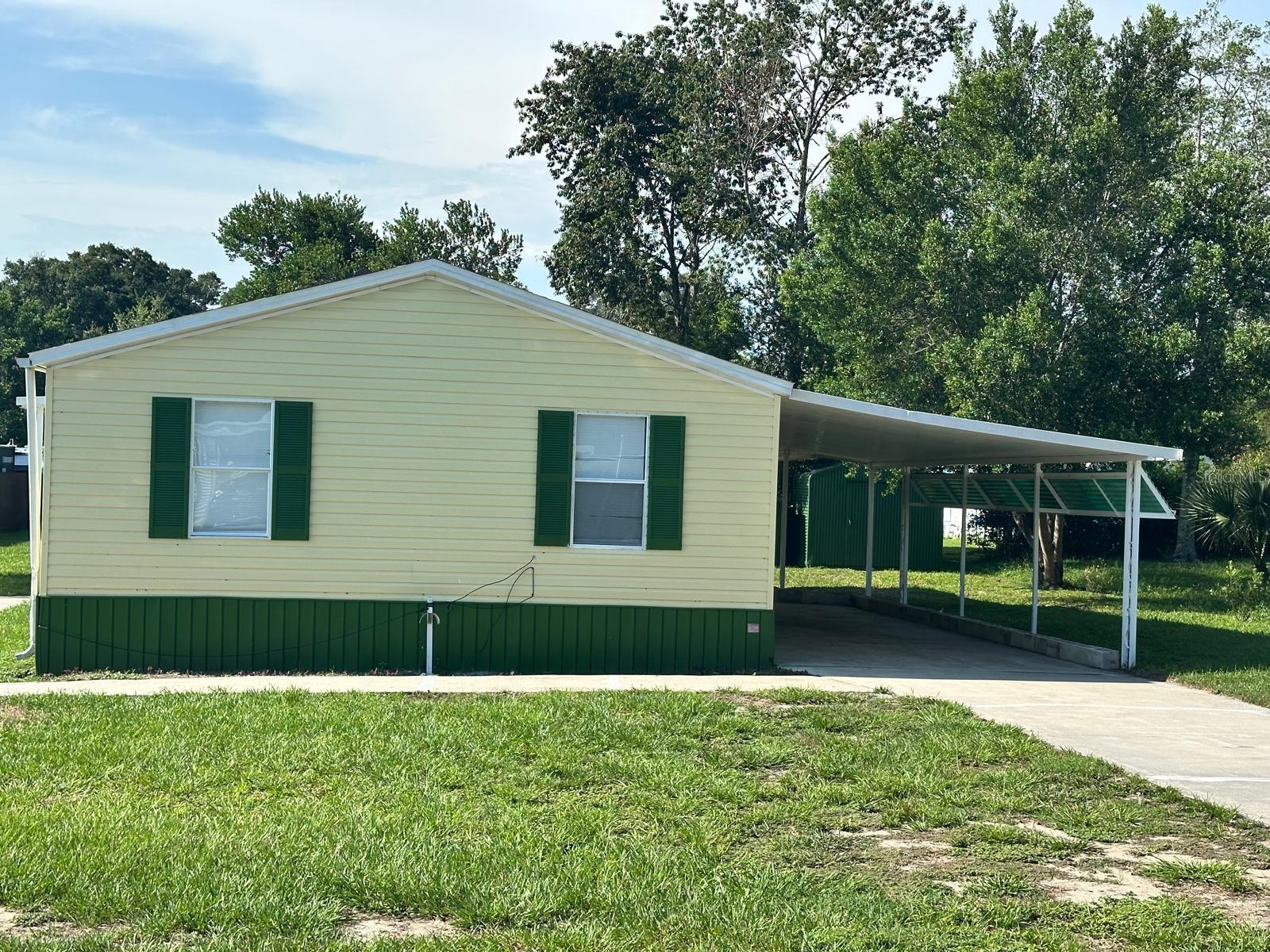 Unique opportunity in Bahia Oaks, Ocala! Located just a few feet from SW 60th Ave with immediate access to SR-200, this property offers the perfect combination of convenience, security, and comfort. This 1,152 sq ft manufactured home is in excellent condition and provides exceptional versatility. The interior has been divided into two independent units, each featuring 2 bedrooms, 1 bathroom, and a full kitchen — perfect for extended families or investors seeking dual rental income.
? Key Features: Own land, no HOA, and a beautifully clean lot. Two separate entrances for easy access and added functionality. Covered carport/garage on one side for shade and vehicle protection. Recent upgrades: brand-new flooring, remodeled bathrooms, fresh interior and exterior paint. Updated infrastructure: brand-new septic systems + city water. Large storage building in the back for extra convenience. The neighborhood is quiet and secure, while still being just minutes from shopping, dining, hospitals, and I-75. This property is the perfect mix of location, value, and investment potential.