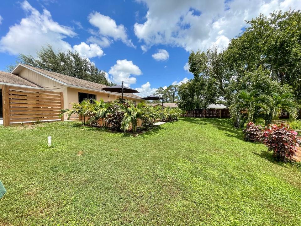 This waterfront 3/2 dream home is an absolute gem and one of the best properties on the market. The house is renovated and well maintained + was completely painted (e.g., trim, doors, walls, and ceiling). Additionally, it boasts granite countertops, upgraded kitchen cabinetry, stainless-steel appliances, 20-inch tiles, dual owner suites, and an expansive, open living area that overlooks a gorgeous backyard. Enjoy peace and privacy with almost 300ft of fencing installed last year + a HUGE, custom deck for you to enjoy. Even better, the house is on a beautiful corner lot with hammocks and rocking benches under a shaded oak tree with dock to Lake Grassy. Includes access to Sun n Lakes amenities.