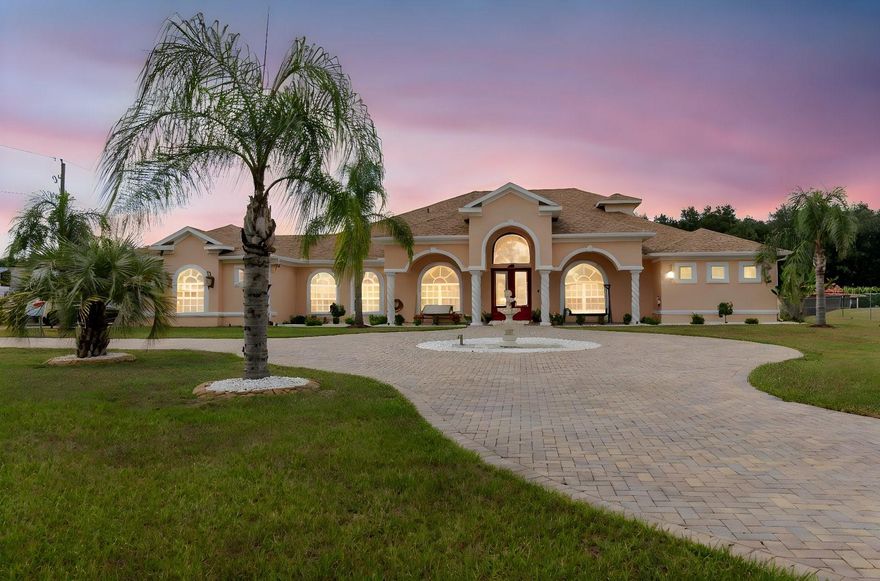 Short term rental, bring your boats, RV's. Welcome to this custom-built luxury estate on 1.43 acres with NO HOA or deed restrictions! Offering 5 bedrooms, 5 bathrooms, and over 4,428 sq. ft. of living space, this home combines elegance, comfort, and freedom. Step inside and you’ll be greeted by soaring ceilings, crown molding, custom tilework, and elegant chandeliers. The gourmet kitchen features granite countertops, custom cabinetry, and a built-in wine rack—perfect for entertaining. The spacious downstairs master suite includes custom walk-in closets, a private sitting area, and a spa-style bathroom with dual vanities, a jetted tub, and dual walk-in shower. Upstairs, enjoy a large entertainment room with a private balcony, plus an additional bedroom and full bath—ideal for guests or family. Outdoor living is just as impressive, with a screened-in covered patio, hot tub, fruit trees, and beautifully landscaped grounds. The property also features a detached garage/workshop, storage shed, 2-car carport, and a brand-new roof. Bring your toys—boats, RVs, ATVs—this property has room for it all, with no HOA restrictions! Conveniently located with easy access to both Tampa and Orlando, this home offers the perfect blend of luxury, space, and tranquility.