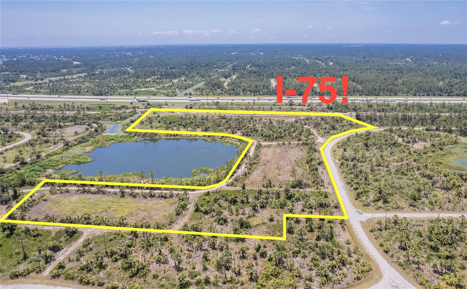 RARE opportunity to purchase 10+ ACRES in rapidly growing North Port, Florida! This is quite an opportunity for a developer or investor who is looking toward the future. This one of a kind, horseshoe shaped property surrounds a beautiful pond, which is approximately 5 acres and belongs to the city. It is zoned RSF-2, for residential single family homes. Drone photographs show its close proximity to I-75. Although you will feel like you are out in the country, you are less than 10 miles from many local shopping and dining destinations. Truly the best of both worlds!