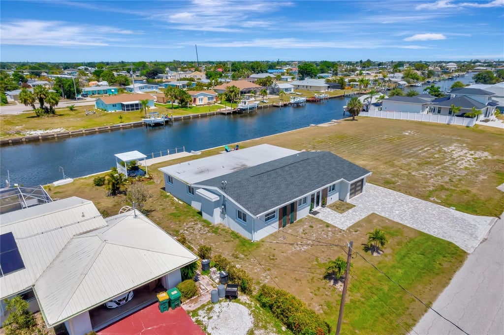 Photo of 106 Leland Street SE, Port Charlotte, FL 33952 (MLS # O6448609)