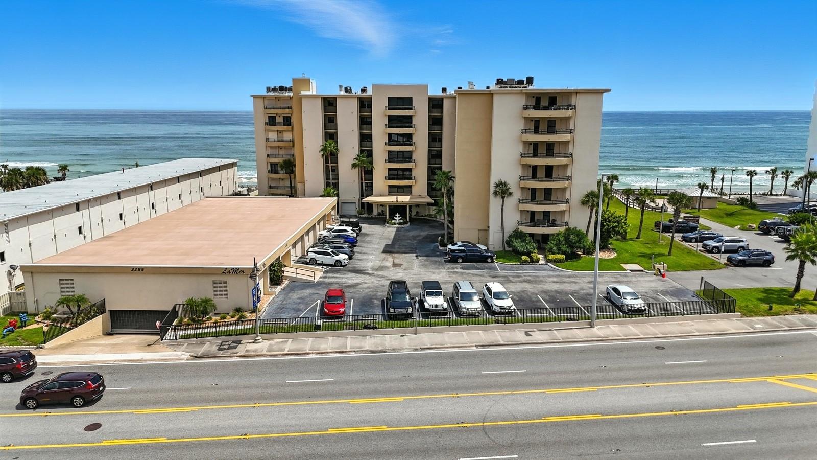 Welcome to a place where the ocean greets you each morning and the river bids you goodnight. This stunning 3-bedroom, 2-bath condo isn’t just about square footage—it’s about feeling. From the moment you step inside, you’re wrapped in light, space, and serenity. The updated kitchen and bathrooms offer clean lines and modern finishes, making everyday living feel effortless and elevated. But the true magic lies just beyond the glass doors: two generous balconies, each with its own personality. One faces the Atlantic, where sunrises paint the sky in soft golds and blues. The other overlooks the river, where evenings glow with fiery sunsets and gentle breezes. Whether you’re hosting friends, sipping coffee in solitude, or simply watching the tide roll in, this home invites you to slow down, breathe deeply, and live beautifully. It’s coastal living with heart—refined, relaxed, and ready to welcome you.