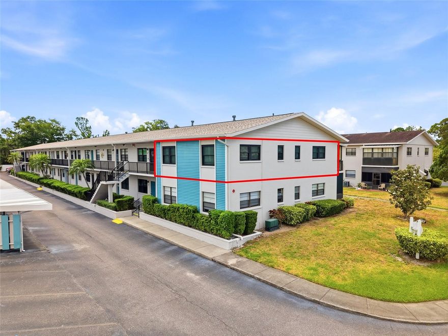 Wow!  This is a top floor 2 bedroom/2 bathroom CORNER UNIT with a deeded COVERED PARKING SPOT and a private balcony that has been COMPLETELY UPDATED from top to bottom.  It is located in the Bedford Building which is one of only a few smaller and more quaint 2-story buildings.  The Bedford Building is also only a short walk to 2 of the community heated pools and the Magnolia Clubhouse. As soon as you open the front door, you will be greeted by the WIDE OPEN FLOOR PLAN with an abundance of NATURAL LIGHT from all the NEW ARMORTECH VINYL DOUBLE HUNG HURRICANE IMPACT WINDOWS (installed 2025).  The CORNER unit provides EXTRA WINDOWS for more natural light.  The kitchen has been beautifully UPDATED in 2024 by changing a small closed in galley kitchen to an OPEN, vibrant, and inviting kitchen.  It has gorgeous QUARTZ countertops with a BREAKFAST BAR, white cabinets, Stainless Steel appliances, RECESSED lighting, beautiful glass tile backsplash, a GAS STOVE, water filtration system, updated GFI outlets and dimmer switches, and under and over cabinet lighting.  There is NEW LUXURY VINYL PLANK flooring throughout for easy cleaning providing a  seamless flow.  Both of the bathrooms were nicely UPDATED in 2026.  Additional updates include: NEW Bryant A/C system in 2025; NEW Electric panel in 2024; NEW thermostat in 2025; NEW roof on the building in 2024; NEW Exterior paint in 2026; NEW shut off valves installed in both bathrooms in 2026; Popcorn ceilings removed and textured; NEW Interior paint; NEW 4.5" baseboards; NEW light fixtures and hardware; NEW 2" wood-like blinds throughout; and more.  Both of the bedrooms are a good size with the Master Bedroom offering a private enclosed balcony to enjoy your morning coffee or evening wine.  The HOA fee includes everything except your electric: Water, Gas, Cable, Hot Water, Internet, Trash, Pest control, Exterior Maintenance, Grounds Maintenance, etc.  Five Towns is a vibrant and very active 55+ community on 111 acres with 9 ponds, 6 pools (including 5 pools that are heated) and a hot tub, 3 outdoor kitchen style gazebos with grills and refrigerators, tons of walking areas, tennis courts, shuffleboard courts, horseshoe, bocce ball, Pickleball courts, and 2 clubhouses with a billiards room, a library, 2 fitness centers, 2 auditoriums, and 2 card rooms. There are events and social activities happening almost every day of the week, including card games, yoga, Mahjongg classes, exercise classes, painting, card making, quilting, swimming, dances, pancake breakfasts, and more. Many of the amenities have been recently updated or are in the process of being updated. Five Towns is conveniently located just minutes from Publix, Target, Super Walmart, numerous local dining favorites, the VA Hospital, and the Gulf beaches. It's a perfect blend of Value, Lifestyle, and Convenience and is a wonderful place to enjoy as a Seasonal home or enjoy year round as a permanent residence.  Five Towns is a very pet friendly community.  The Bedford Building allows you to have 2 pets under 25 pounds. There is potential to install a washer &  dryer at your own expense inside the unit with board approval (dryer may need to be ventless).  This is the perfect place to fully enjoy the Ultimate Florida Lifestyle!  This unit is absolute perfection and 100% MOVE-IN READY!  The unit is on the 2nd floor but it is a small set of stairs.  The 2nd floor offers more privacy and protection from any flooding.  Schedule your private tour today!
