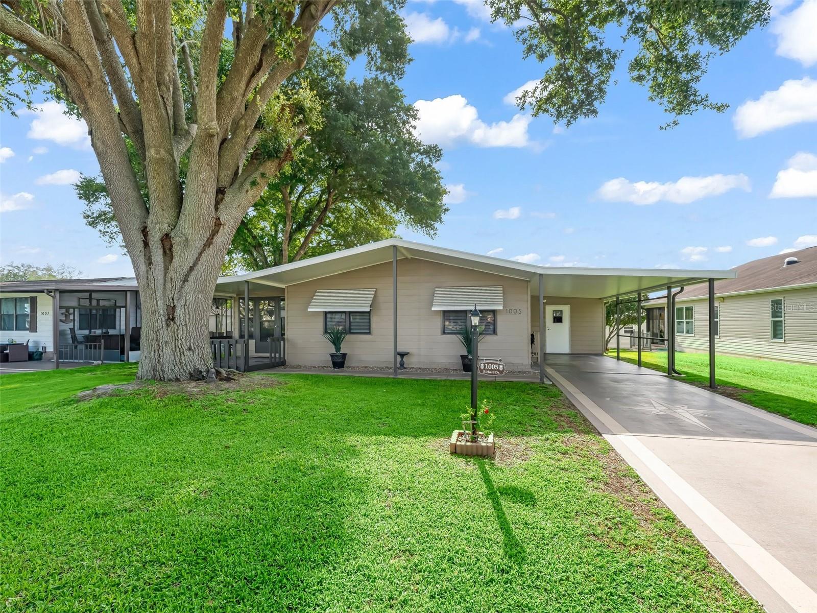 This charming 2-bedroom, 2-bathroom manufactured home offers a spacious and inviting living space, perfect for comfortable living.
Key Features:
~Vaulted Ceilings & Open Floor Plan: Enjoy an airy, expansive feel with vaulted ceilings and an open layout that seamlessly connects the living, dining, and kitchen areas.
~Light & Bright Kitchen: The kitchen is designed to be both functional and stylish, featuring stainless steel appliances, ample cabinetry, and a layout that makes meal preparation a breeze.
~Lanai Under Heat & Air Conditioning: Relax year-round in the enclosed lanai, which is fully conditioned to provide comfort regardless of the season.
~Dining Room with Storage: The dining area is not only spacious but also includes built-in storage, offering both functionality and convenience.
~Outside Laundry: For added convenience, the laundry facilities are located outside the main living area, freeing up space indoors and offering easy access.
~This home combines practical features with a comfortable living environment, making it an ideal choice for those seeking a cheerful and quite space.
~Painted driveway, Roof 2023, A/C 2016
~furniture available on a separate package