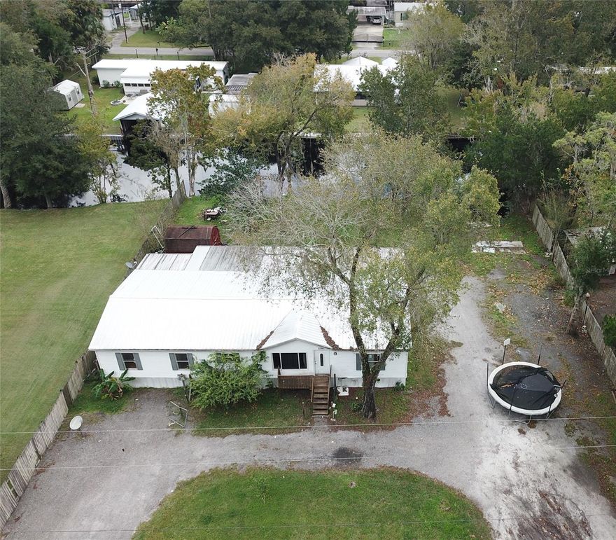 LOCATION!!! LOCATION!!! LOCATION!!!! THIS PROPERTY PROVIDES A DEEP WATERFRONT CANAL ACCESS TO THE PICTURESQUE BEAUTY OF THE ST. JOHNS RIVER. CRUISE TO SILVER GLEN TO COOL OFF IN YEAR ROUND 72 DEGREE SPRINGS, OR JUST VISIT SURROUNDING AREAS WITH GREAT FISHING. THE LOT INCLUDES A BOAT SLIP FOR A POSSIBLE BOAT HOUSE OR DOCK. THE HOME IS A MANUFACTURED 4 BEDROOM 2 BATHROOM HOME, WITH A FIREPLACE. LIVING ROOM LOOKS OUT TO THE CANAL. THE COVERED BACK PORCH HAS PLENTY OF ROOM FOR ENTERTAINING WHICH INCLUDES SINK AREA FOR CLEANING FISH OR FOR A OUTDOOR KITCHEN. IT ALSO INCLUDES AN EXTRA ROOM FOR AN OFFICE OR EXTRA BEDROOM. THE MASTER BEDROOM HAS A SPACIOUS BATHROOM AND WALK IN CLOSET. METAL ROOF ADDED IN 2016. AC IS NEWER. THE HOME NEEDS REPAIRS DONE. ;Water: City