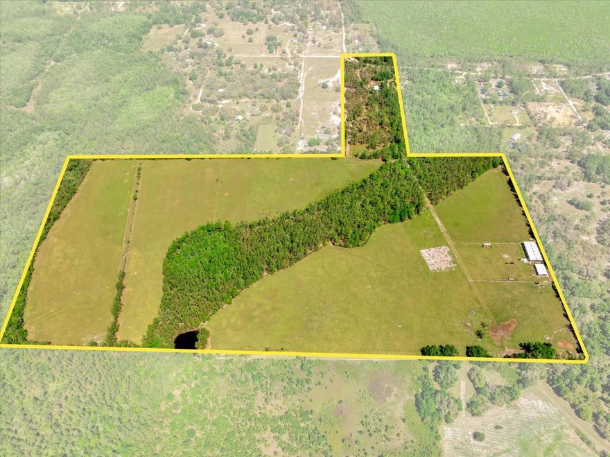 94-Acre Ranch
Discover this exceptional 94-acre property, fully fenced with brand-new barbed wire and featuring improved pasture ideal for cattle grazing. The ranch is fully equipped for a smooth operation with a 140-foot deep well, septic system, underground electric, and a 200-amp transformer.
Key features include a 120’ x 60’ metal building (built in 2021) that houses an impressive two-bedroom, three-bath barndominium, and a 40’ x 60’ pole barn (built in 2018) with five oversized roll-up doors. An efficient irrigation system and an abundance of local wildlife further enhance the appeal of this property.Also included are parcels 19-24-25-0003-000-03100 and 19-24-25-0003-000-03300 and 19-24-25-0003-000-12400
All keys are included for immediate access to every facility. Whether you’re looking to expand your cattle operation or embrace the country lifestyle, this ranch offers a ready-to-use, turnkey opportunity. Contact us today to learn more or schedule a viewing.