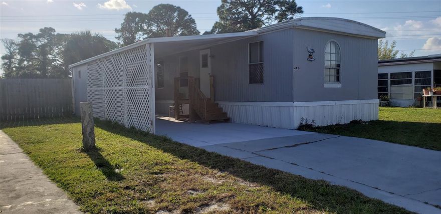 Relax owning your own land with this 2 bedroom 1 bath manufactured home.New A/C System, New Carpet/Flooring.Air Conditioner System, Large workshop/storage room A great starter home Or weekend retreat to relax along the river ....Be a part of the riverfront community that offers the quaintness of a small fishing village. This home offers a fenced in large private backyard and is located along the perimeter of the community. Double concrete slabs allow for potential additions.  Property zoned for construction of stick home. Low monthly amenities of $131.00 per month. Community offers 300' of fishing pier, boat launch, recreational vehicle storage, community club house, BBQ grill, boccie ball, shuffleboard, 2 built in community pools (salt water), basketball, social club and much more. Come and be a part of this golf cart community. Room sizes are approximate ;Water: City
