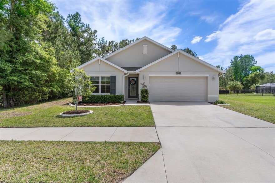 Welcome to 17528 Garsalaso Circle, located in the highly desirable gated golf course community of Hernando Oaks.  This 4-bedroom, 2-bath pool home with a 2-car garage offers 1,851 square feet of living space on a spacious quarter-acre lot.  This home features custom landscape curbing, a decorative glass front door and no front or rear neighbors  to add to the privacy and curb appeal.  

Inside, this home features a functional open-concept layout with luxury vinyl plank flooring and ceiling fans throughout for year-round comfort. The kitchen is equipped with all stainless steel appliances, abundant cabinetry and a large walk-in pantry.  It flows easily into the main living and dining areas, making it ideal for everyday living and entertaining. The primary suite features a spacious en-suite bathroom with dual sinks and a large walk-in closet.  Additional interior highlights include cabinets in the laundry room for extra storage, a whole-home water softener, and an epoxy garage floor coating for a clean, finished look.

Step outside to a covered, brick paver screened lanai overlooking the pool, providing a private outdoor space ideal for relaxing or hosting guests. The expansive yard offers room to enjoy nature and outdoor activities, enhanced by a fully irrigated lawn and a full gutter system for added functionality and maintenance ease.

Located in a community with a low HOA and no CDD, this home offers a balance of privacy and affordability while still being close to shopping, dining, and everyday conveniences.

This property delivers a combination of indoor comfort, outdoor living space, and a desirable lot setting, making it a strong option for buyers seeking a move-in ready pool home.