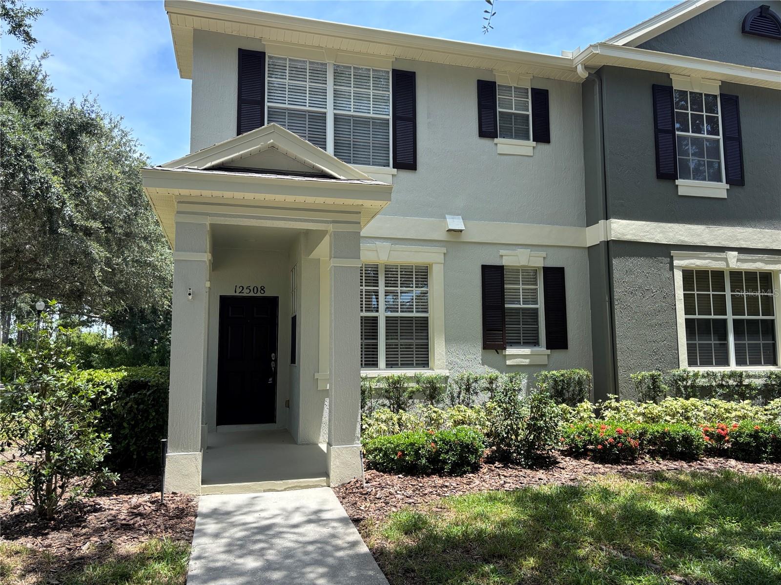 AVAILABLE NOW! NEWLY RENOVATED!! Windermere end-unit with 2 bedrooms, 2.5 bathrooms and a 2 car garage , located minutes from Disney and shopping! Upon entering the front door you are drawn to the freshly painted inviting, crisp, modern paint color and the upscale interior finishes with new luxury vinyl floors throughout , tiled bathrooms, high ceilings , crown molding and all new window blinds.No carpets here! As you gaze towards the cheery kitchen, you will notice the light, appealing granite counters . Light floods the space creating a warm welcoming place to call home. There are 2 spacious suites upstairs, each with it's own bath so there’s no waiting to get ready for the day. The Primary has a generous walk-in closet, dual sink vanity with granite counter top and glass enclosed walk in shower. The living space overlooks your private enclosed courtyard area . The back area has pavers and connects to your 2 car garage. At the end of the day you can relax in your back patio retreat or at the gorgeous community pool. This home is in pristine condition (home professionally cleaned). Landlord has A/C serviced annually plus periodic pest control .This home will allow you more time to relax and enjoy life as lawn care is also included. Home exterior has been recently painted as well. Come live the Florida lifestyle you deserve. Sorry no pets.