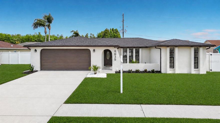 Welcome to a beautiful, newly updated and meticulously maintained 4 bedroom, 2 bath, 2 car garage pool home in Wood Trail Village! Located on a beautiful and quiet street, this home boasts 1760 square feet of living space. Remodeled from top to bottom, this home is move in ready! With head turning curb appeal, this home combines location with luxury living.  From the moment you step onto the property, you will notice the contemporary tiled entryway, lush landscaping and new exterior paint. Seller to have new sod laid covering the entire front yard before close or give credit to buyer towards additional landscaping. (Some images have been enhanced and/or staged for publishing purposes only). As you enter the bright home, you will immediately notice the new luxury vinyl plank flooring, gorgeous light fixtures and huge open floor plan. The open layout centers on a newly renovated kitchen, flaunting white shaker cabinets, gold pulls, quartz countertops, oversized sink with commercial faucet, new stainless appliances, new lighting and a completely custom wood range hood. Enjoy the beauty of the home which is sure to be great for family, friends and entertaining. Just one step through the sliding door and you will be thrilled to find the pool and patio, where you will be sure to enjoy seamless entertainment. Room for a grill and patio furniture, this is Florida living at it's finest. This residence offers a renovated patio, newly resurfaced pool and huge vinyl fenced in yard. Entering the guest bath you will notice custom designed tile, custom wood trim and beautiful new fixtures. In addition to the spacious kitchen, you will also find a formal living and dining room so you can be sure to have space for friends, family and guests. The split floor plan places the large primary suite on the other side of the home, where you will also be captivated by the primary bath. With a stunning vanity, custom tile and niche, luxury fixtures and lighting, this master suite will be sure not to disappoint. In addition to the features of the home, inside the 2 car garage you will find it too is completely updated and includes a new garage door and epoxy floors. New roof - replaced in 2026, electrical panel upgrade 2026, pool resurface 2026 new slop sink, heat/ac in great condition, new epoxy garage floors, and all appliances are brand new with transferrable warranty. Conveniently located with access to all the things you love to do. This home won't last!! Schedule your showing today.