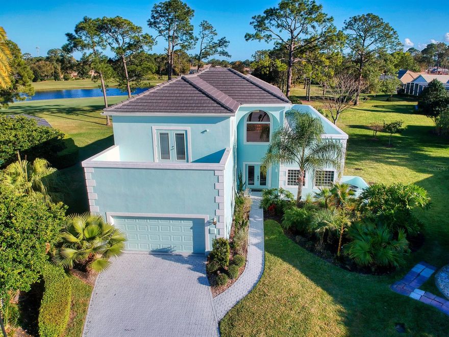 This beautiful 3 bedroom 3.5 bath home located in the desirable gated community of Plantation Bay is a must see!  Start your day with a refreshing swim in your private heated pool in the spacious screened lanai.  In the evening, enjoy the expansive golf course view with a peaceful water feature from your very own roof top deck as you watch the sun set on another gorgeous Florida day.  The upgrades and renovations in this home are impressive.  The concrete tile roof was installed in 2019, the water heater was installed in 2018, the upstairs AC is 8 years old and the downstairs unit is 6 years old.  The kitchen was beautifully renovated and boasts quartz counter tops, glass subway tile back splash, large farm sink and cabinets with glass front features, all new in 2016.  The Italian Marble flooring is original and runs throughout the kitchen, casual dining and bar area.  Entertaining is a breeze with French doors opening from the living room, with vaulted ceiling and natural light streaming in from panoramic windows, onto the pool deck with plenty of space for outdoor dining.  The primary bedroom, located on the first floor, has a spacious walk in closet and an inviting spa like bathroom with a stand alone tub and waterfall shower.  The elegant spiral staircase leads to the second floor with two private guest suites each with its own access to the rooftop deck and two upstairs bathrooms.  Both of the guest  bathrooms were completely redone in 2020  with new custom tile work, lighting, mirrors, fixtures, etc.  The Plantation Bay community offers many amenities and a variety of memberships are available (golf, sports, social, etc.)  Located close to the beach, state parks, shopping, restaurants and many other activities makes this an ideal location to enjoy the Florida lifestyle! ;Water: City