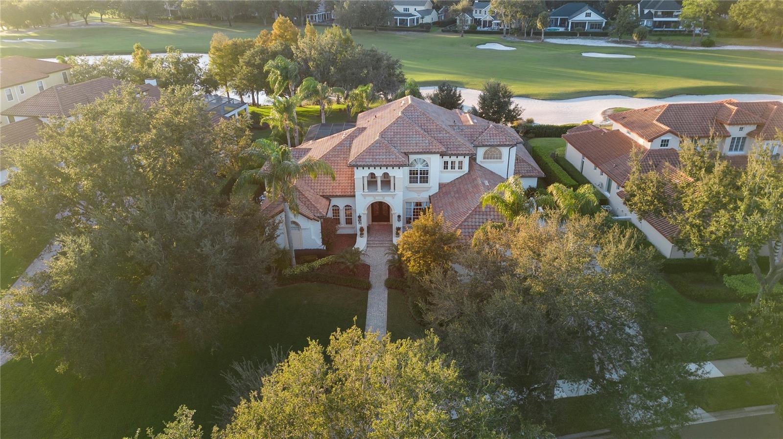 Welcome to this stunning estate located at 6252 Greatwater Dr, on the 18th hole of the pristine Golden Bear Club in Keene's Pointe. This exquisite property boasts a generous 6699 square feet of living space, offering ample room for comfortable living and entertaining.
As you step inside, you'll be greeted by the spacious and airy interior, featuring 5 bedrooms and 6 bathrooms. The primary bedroom offers a luxurious retreat with an en-suite bathroom, providing a perfect sanctuary to unwind after a long day.
The gourmet kitchen is a chef's delight, equipped with high-end appliances, beautiful cabinetry, and ample counter space. It seamlessly flows into the open living and dining areas, creating an ideal setting for hosting gatherings and creating lasting memories with loved ones.
Outside, the property features a beautifully landscaped yard, providing a serene outdoor oasis for relaxation and enjoyment overlooking the 18th hole. The expansive patio area offers an updated outdoor kitchen, and newly resurfaced spa pool.
Conveniently located in the heart of Windermere, this home offers easy access to a variety of nearby shopping and dinning amenities. Surrounded by A rated schools, and just minutes from the theme parks, this home truly has it all.
Don't miss the opportunity to make this remarkable residence your own and experience the ultimate in luxury living. Schedule your showing today and envision the possibilities of calling this remarkable property "home."