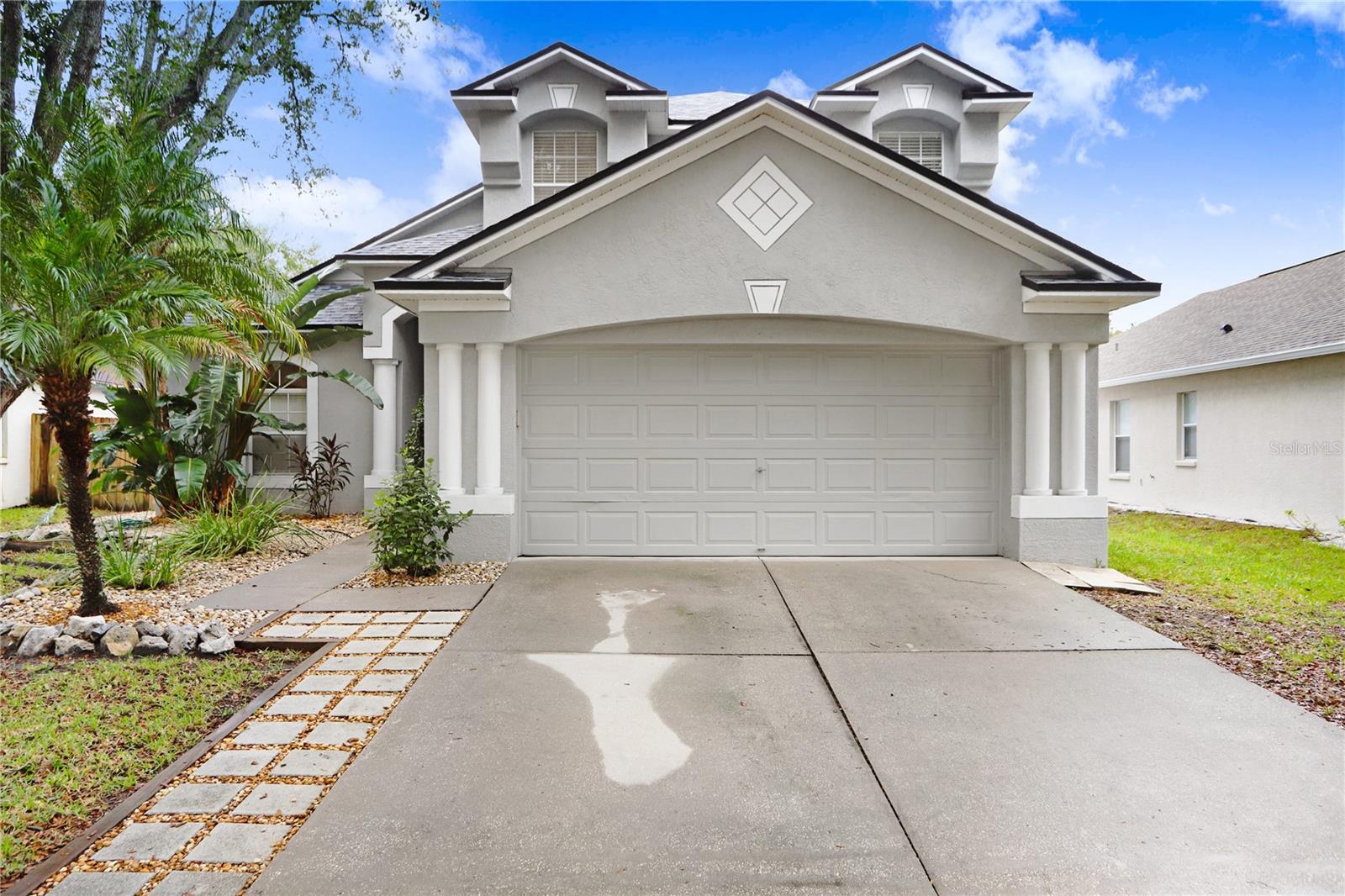 **SELLER TO CREDIT BUYER $5,000 AT CLOSING TO USE TOWARD BUYER'S CLOSING COSTS OR RATE BUYDOWN!** Experience the allure of your own Florida paradise with this beautifully updated pool home! This 3 bedroom, 2.5 bathroom, 2 car garage home with loft has NO CDD and has been tastefully upgraded, welcoming you with its tidy landscaping, NEARLY NEW roof (2021), and fresh coat of exterior paint (2022.) As you step into the home, you'll notice the foyer with soaring vaulted ceilings that open up to the second floor. Beautiful & modern NEWER wood look vinyl plank flooring are featured throughout the first floor, for ease of maintenance. The large gathering room opens to the second floor, adding to this room's expansive and light & airy feel. Adjacent to the gathering room is the dining room, with plenty of space to use as casual dining or for more formal dining. Overlooking the dining room is the kitchen, which includes stainless & blk appliances, recessed lighting, dedicated pantry, and breakfast bar that provides additional seating. Sliders just off the dining room lead you to what will quickly become your new FAVORITE place to spend your time...your covered lanai and magnificent screened in pool and spa! The backyard is fully fenced for privacy, and your pool includes cascading spa waterfall and multilevel pool deck, allowing for plenty of room for lounge chairs & fun in the sun. Back inside, just off the gathering room is your large Primary Suite, complete with double door entry for an added touch of luxury. Your upgraded en-suite Primary Bath includes extended vanity with granite counter and double sinks, updated mirrors, walk-in shower with glass enclosure, soaking garden tub, and linen closet. At the top of the stairs, you'll find a spacious loft with a half wall that overlooks the gathering room - making this an ideal bonus space with endless options for use...will you make it your game room? Exercise room? Home theatre? Home office? The sky's the limit! 2 secondary bedrooms are located just down the hall from the loft, as well as a full bathroom that includes an extended vanity. Back on the first floor of the home, you'll find the laundry room, complete with a "Harry Potter" closet providing additional storage space. A convenient half bath for guests is located adjacent to this space. Other upgrades to the home include NEARLY NEW water heater (2021); NEWER A/C (2018); BRAND NEW entryway pendant light; BRAND NEW dining room pendant light; ceiling fans w/lights throughout & more. Situated in ideally located Kings Lake, with amenities including community lake, basketball court, park, and playground. Easy & quick access to I-75, US-301, US-41, Big Bend, and the Selmon Expressway, with plenty of options for dining, shopping, & recreation, as well as St. Joseph's Hospital South and dog-friendly Apollo Beach Nature Preserve located nearby.