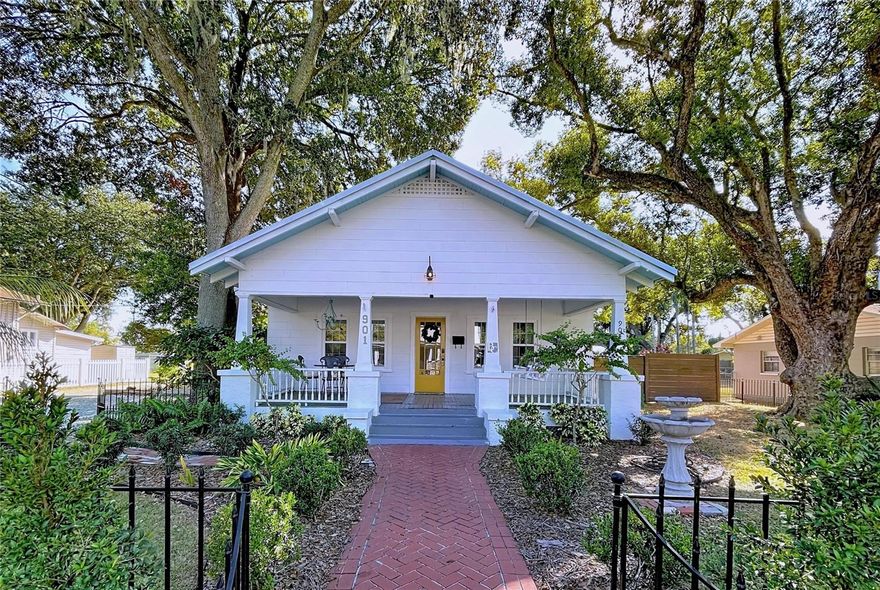 The Sebastian House – Historic Beauty with 
Modern Comforts & Income Potential
Step into a piece of Plant City history with The Sebastian House, a beautifully restored 1934 gem located in the heart of the Historic District. Local legend holds that this home was once owned by Dillard Sebastian, one of the early pastors in town, and later provided lodging for rail workers during the expansion of Henry B. Plant’s railroad system.
Lovingly maintained and thoughtfully updated, this home blends timeless craftsmanship with modern amenities. Original heart pine floors, bead-board walls, plaster accents, and period doors and windows preserve its authenticity, while updates such as a new HVAC system, all new sound deadening windows throughout, and a fully renovated kitchen and baths offer modern conveniences with vintage charm.
The inviting front porch adds to the nostalgic appeal of living in the Historic District. Inside, the spacious front music room features the original fireplace, while French doors open to an elegant den area with a classic chandelier.
Each of the large bedrooms offers its own distinctive charm. The primary bedroom has an en suite bath with fresh white tiles and a bidet, as well as his and her walk-in closet. The other bedrooms are roomy and filled with beautiful natural light. 
The bright kitchen has been freshly fitted with marble countertops, stainless steel appliances, New 2-drawer style dishwasher, New stainless sink with commercial faucet, and soft-close cabinetry. It hosts a walk-in pantry and a cozy breakfast/tearoom, filled with light and personality. 
From the tearoom, fitted with pet-flap, you can enjoy a private covered porch perfect for entertaining and a rustic carriage house with its original tin roof—a true historic treasure. The side garden holds a jasmine vine archway fitted with a private outdoor shower. The corner lot features an automatic gated driveway, security cameras, and ample gravel parking. 
If you choose, you can continue to benefit from the beautiful bungalow’s easy-maintenance food forest. The 8,500 sqft lot features an irrigation & rain barrel system, papaya, banana, star fruit, longevity spinach, and more tasty edibles suited to Central Florida's climate.  
This property is also equipped for home office use and has successfully operated part-time as an Airbnb generating approximately $10,000 annually, offering both residential enjoyment and income potential.
Plant City is known for its southern charm, sense of community, and world-famous Strawberry Festival (walking distance from house). Just a ½ mile to the east is Plant City’s lovely, historic downtown, and ½ mile to the west is Rowena Mays Park, which is currently undergoing a $6M renovation. Conveniently located between Tampa and Orlando, you’ll enjoy small-town living with big-city access just a short drive away. 
Homes like this are rare—rich in history, full of character, and ready for its next chapter. Schedule your private showing today! Ask about our fully furnished options including all indoor furnishings and outdoor lawn maintenance equipment. Take advantage of our assumable 2.867 % mortgage!
