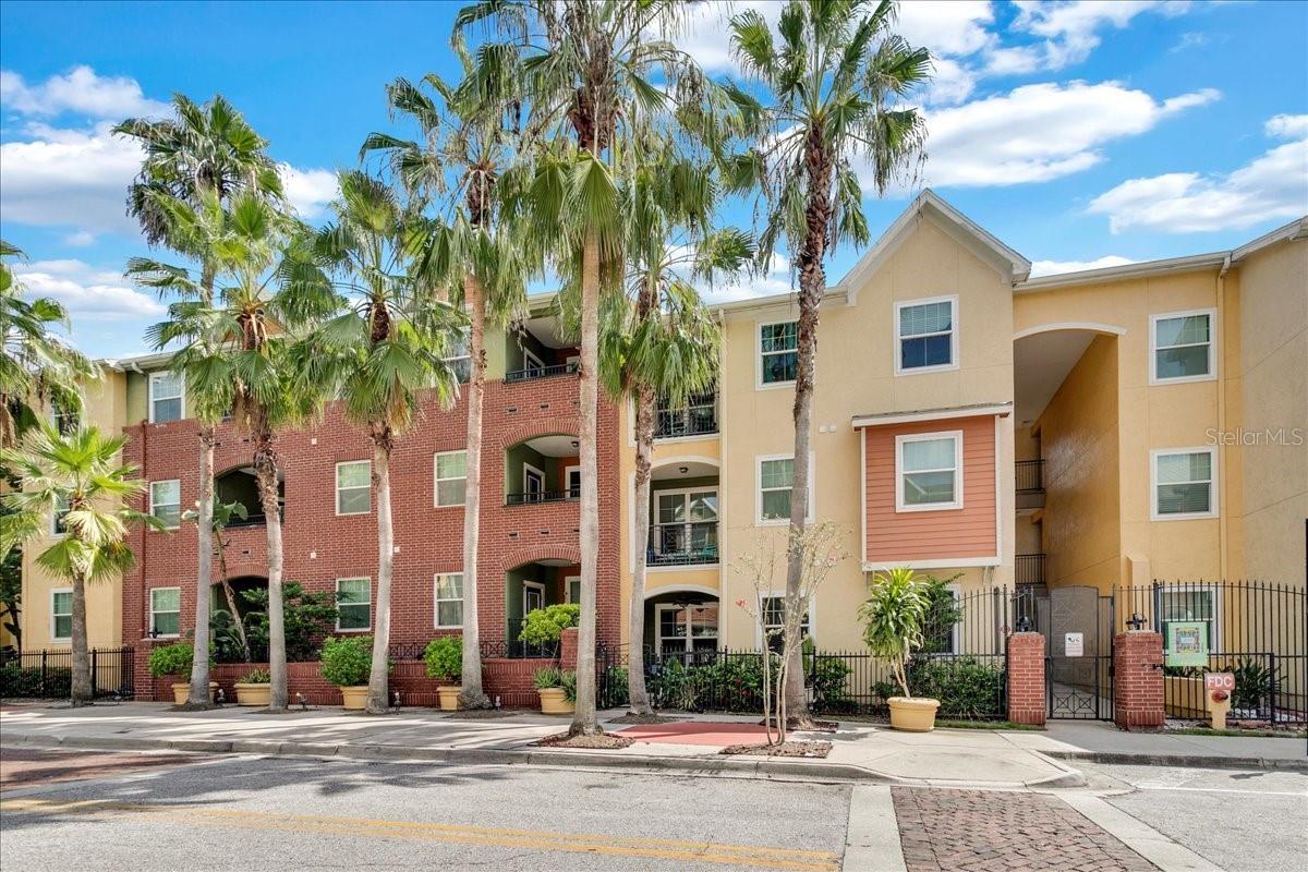 This beautifully renovated top-floor 1-bedroom condo in The Quarter at Ybor is available fully furnished or unfurnished. The spacious open floor plan features new laminate flooring and fresh paint throughout. The expansive living room (13' x 22') includes large windows that overlook the balcony, a built-in shelving unit, and a breakfast bar that connects to the brand-new kitchen. The kitchen showcases dove gray cabinetry, quartz countertops, a marble mosaic backsplash, and all-new stainless steel appliances, including a range, microwave, dishwasher, and refrigerator. Adjacent to the kitchen, the dining room boasts a large window and direct access to the balcony, making it perfect for entertaining. The primary suite features a bright bedroom with laminate flooring and a huge walk-in closet. The newly renovated en-suite bath includes a walk-in shower, double sink vanity with LED mirrors, and a convenient full-size laundry closet. The Quarter at Ybor offers a host of amenities, including a secured gated entry parking garage, on-site management office, reading room, fitness center, and a club room with a catering kitchen. Residents can relax by the pool and hot tub, enjoying a vibrant community atmosphere. Located in historic Ybor City, you'll find a variety of restaurants, bars, nightclubs, and shopping options within walking distance. The condo is also centrally situated, adjacent to downtown Tampa and the Channel District, making it a perfect spot for those seeking both entertainment and convenience. Enjoy the best of urban living in a charming historic setting! $1700 unfurnished 12 month lease. $1850 unfurnished 7 month lease. $2000 furnished 12 month lease. $2150 furnished 7 month lease.