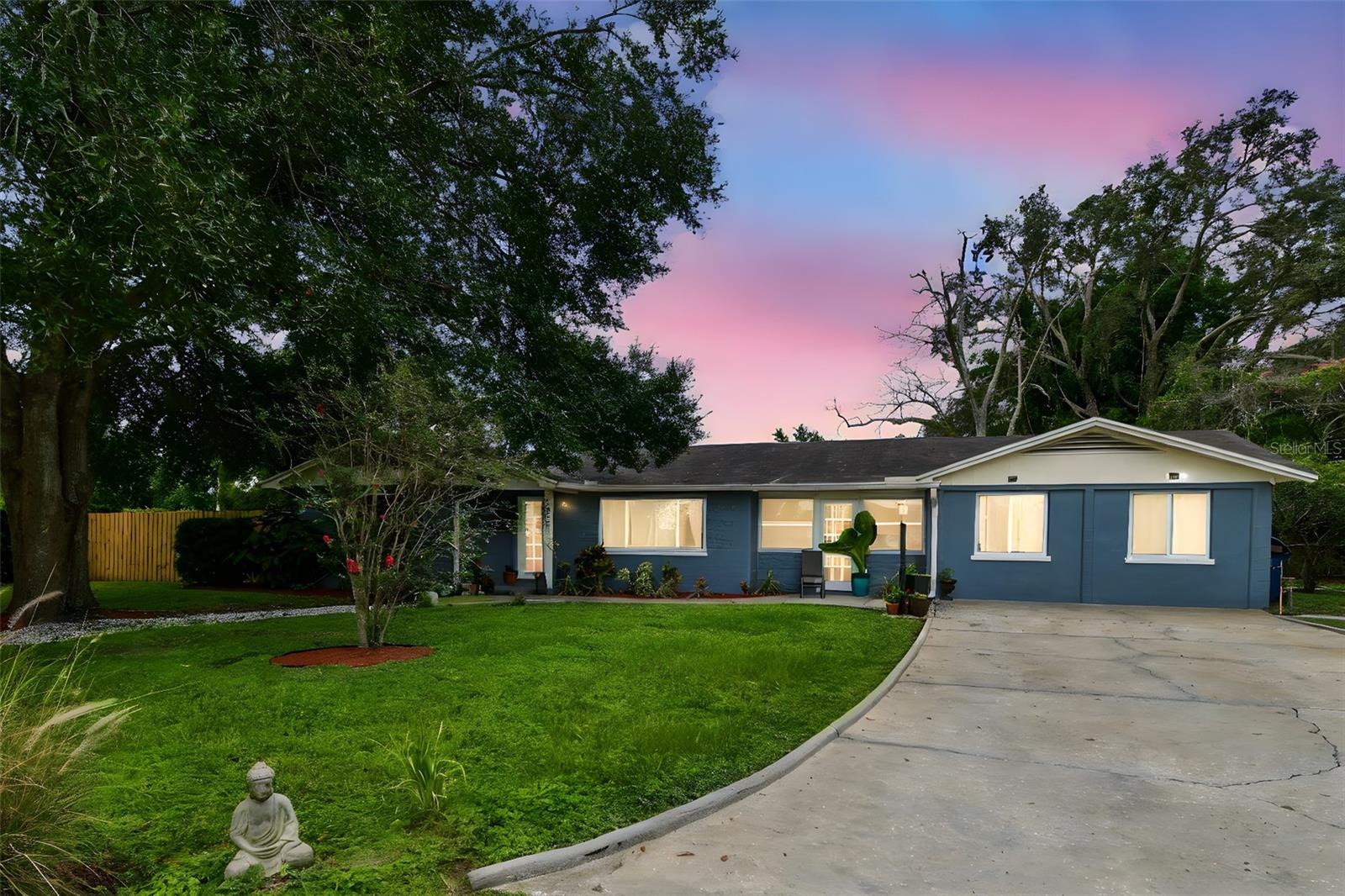 This stunning ranch-style home in beautiful Forest Hills offers exceptional curb appeal on a large corner lot, with the front of the property facing the Babe Zaharias Golf Course. Featuring 3 spacious bedrooms, 2 bathrooms, and 1,928 square feet of living space, the residence welcomes you with a bright and open living/dining area adorned with elegant tile flooring and neutral tones. The open floor plan flows seamlessly into a sunlit kitchen equipped with sleek appliances, rich cabinetry, and granite countertops, while the adjacent family room provides the perfect space for entertaining. The oversized primary suite boasts a walk-in closet and ample room for any bedroom set, complemented by a luxurious en-suite bath with a granite vanity, soaking tub, and expansive shower. Secondary bedrooms are generously sized with plenty of closet space. Step outside to a large fenced backyard featuring brick pavers, a firepit, a storage shed, and more. Additional highlights include updated windows, a 9-year-old roof, tankless water heater, laminate flooring in all bedrooms, and modern fixtures throughout. Located in the highly desirable Carrollwood area, this home offers convenient access to I-275, top-rated schools, dining, medical facilities, and shopping. Don’t miss the opportunity to make this exceptional property yours—schedule your private showing today.