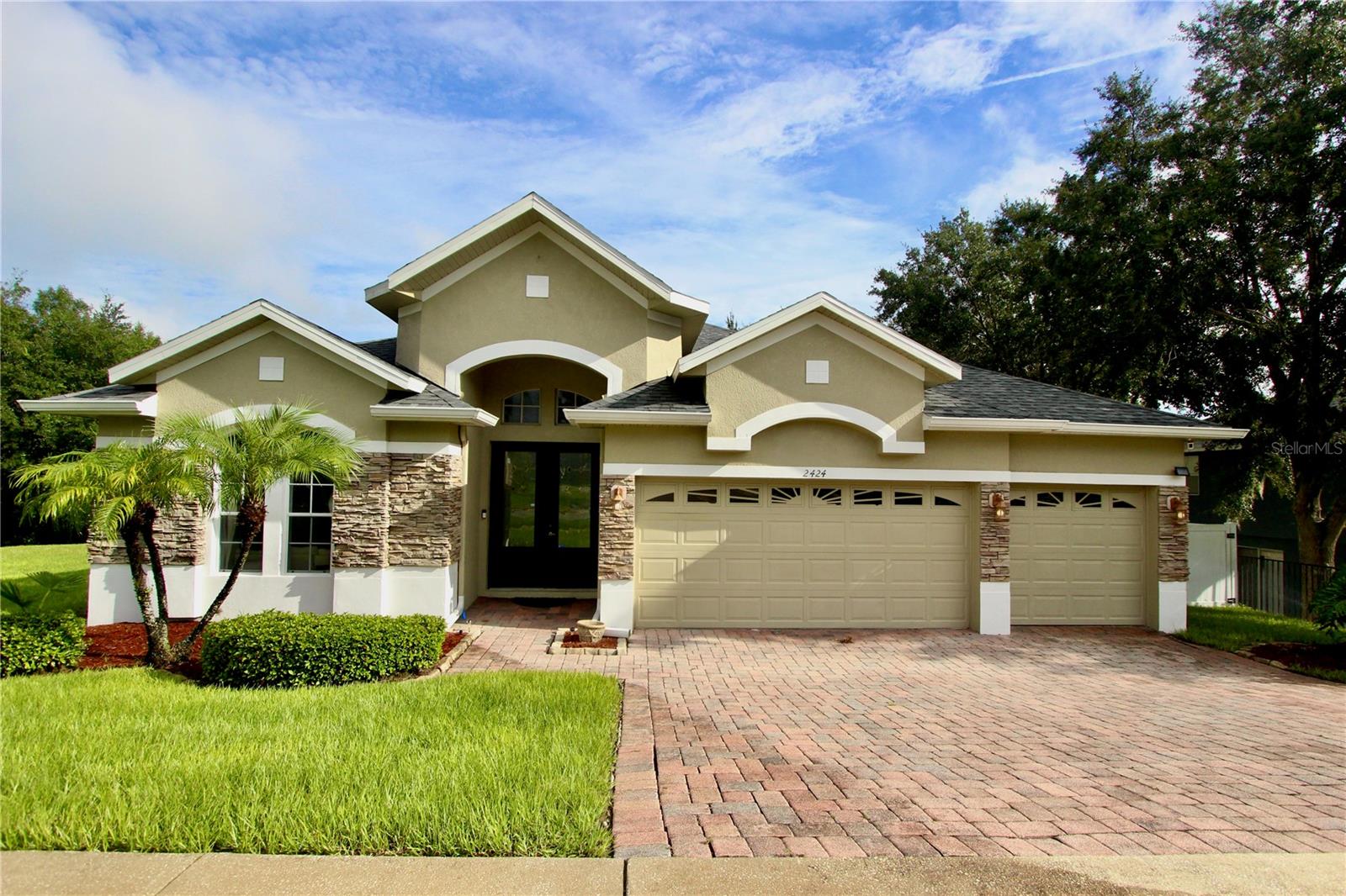 GATED COMMUNITY!! Great Alexandria Place Community! Enter the home with SOARING CEILINGS throughout. AMAZING TRIPLE SPLIT FLOOR PLAN! Four large bedrooms with a triple split layout including a primary bedroom suite with a primary bathroom, and an additional large flex space located at the front of the home that can be used as a home office, studio or playroom. The primary bedroom has a tray ceiling with extra seating area. The primary en suite bath has dual sinks, separate shower stall and large soaking tub, perfect for unwinding at the end of a long day! Kitchen has tons of cabinet and counter top space, pantry, and breakfast bar. Stainless Appliances included as well as washer and dryer. Very spacious Dining Room great for family gatherings. The home is situated on a well-manicured lot and the fully vinyl fenced backyard is a wonderful setting for relaxing or hosting, with conservation and park views. Short walk to the playground. HOT TUB included. Roof 2021. 3 Car Garage. ALL FURNITURE are available for purchase.