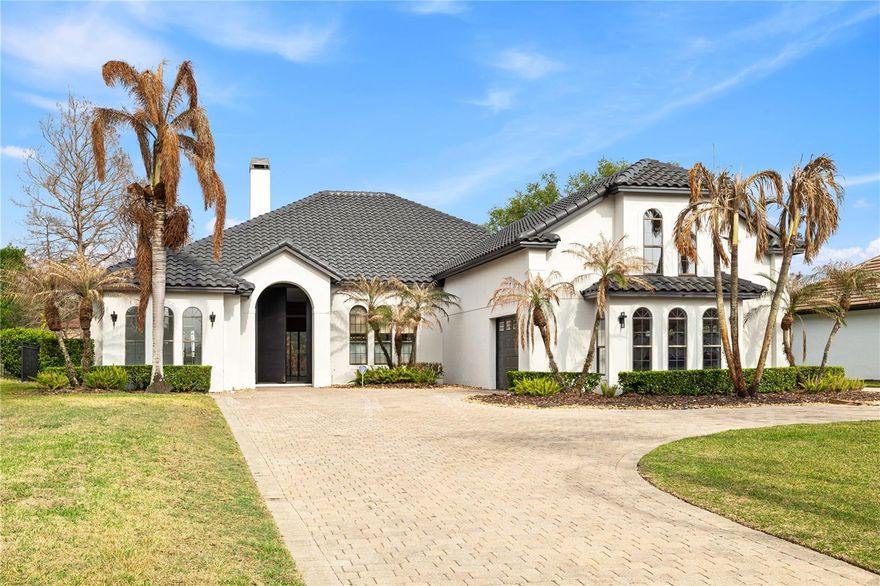 Experience unparalleled lakefront living in this fully renovated Mediterranean-style estate located in the exclusive gated community of John’s Cove on Johns Lake. A grand driveway and manicured landscaping welcome you into a striking modern entry and elegant interior featuring high-end flooring and designer finishes throughout.
Designed for effortless entertaining, the open-concept layout showcases a chef’s kitchen with a waterfall quartz island, custom cabinetry, premium stainless steel appliances, and a full-slab backsplash, all flowing into an expansive living area with designer lighting and seamless indoor-outdoor access.
The primary suite offers a private retreat with abundant natural light, custom closets, and a spa-inspired bath featuring a freestanding soaking tub and luxury walk-in shower. Step outside to a screened pool, upgraded travertine deck, and private pier, creating an unparalleled waterfront lifestyle ideal for relaxation and entertaining.
Additional highlights include a concrete tile roof (maintained), smart home features, updated HVAC, epoxy garage, modern laundry room, and high-end upgrades throughout. Ideally located minutes from Downtown Winter Garden, premier dining, shopping, and top-rated schools, this is a rare opportunity to own an unparalleled lakefront property.