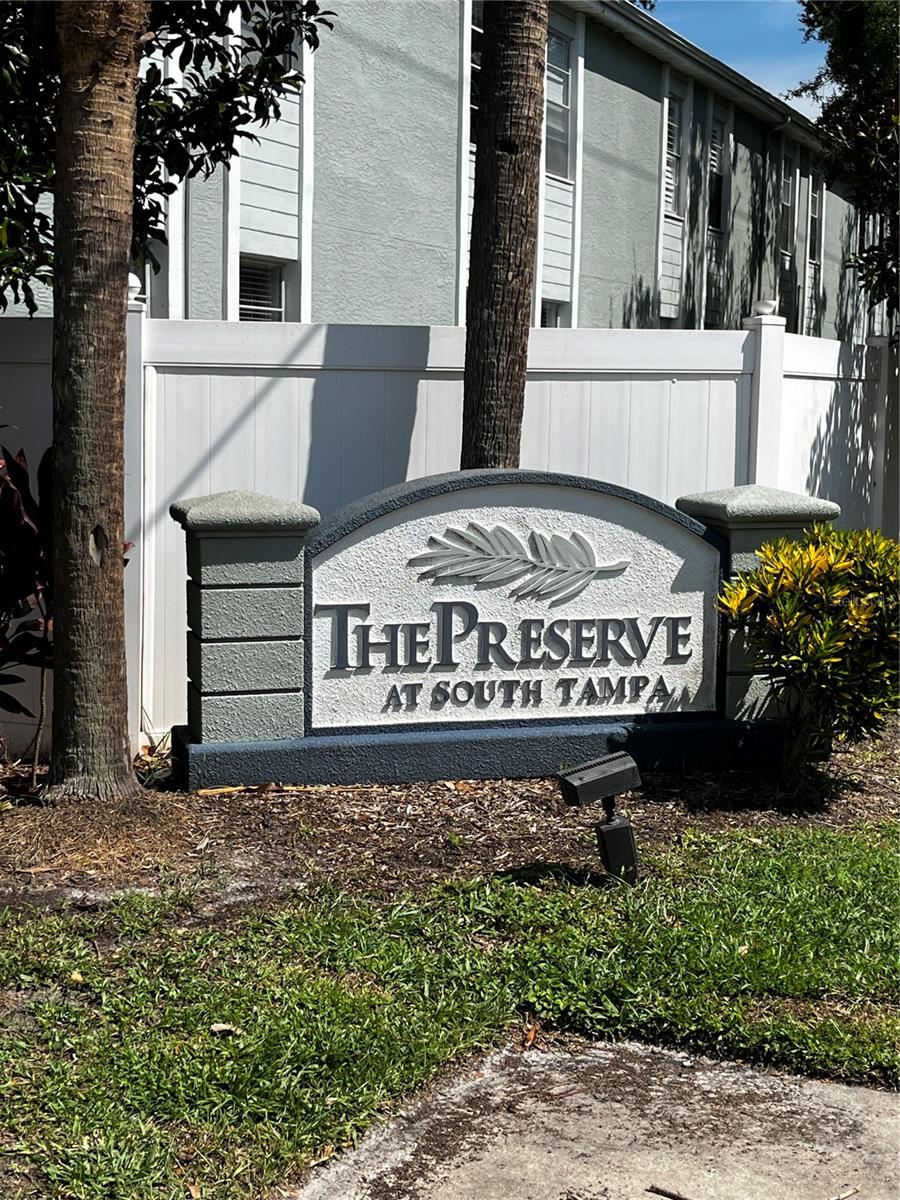 Great opportunity to own in this quiet gated community of The Preserve at South Tampa. These units don't come up very often! Wonderful upstairs unit, with lots of features: open living room & dining area, new Simonton hurricane windows, wood laminate floors throughout the living areas, granite and real butcher block countertops in the kitchen with breakfast bar & newer stainless appliances, ceiling fans, 2 bedrooms with walk-in closets & newer carpet, full bath with laundry closet incl. full-size washer & dryer, hall linen closet & attic storage space as well. Selling at a lower price as-is...Unit is in great shape - just needs painting & minor "primping up"! NOTE: exact unit right below just sold for $200K! (that's instant equity!) Wonderful opportunity for investment too - easy rentals in this complex - last tenant just left after 5 years of renting! Lovely outdoor space in the center of the community offers a gathering place complete with BBQ grill & nice seating area, plus lots of guest parking! Don't miss this one!!